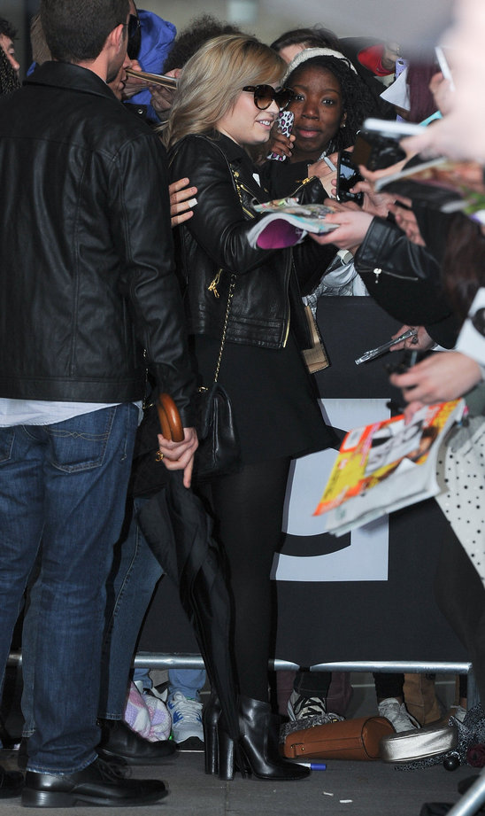 demi_llovato_greeted_by_a_large_crowd_of_fans_in_london.jpg