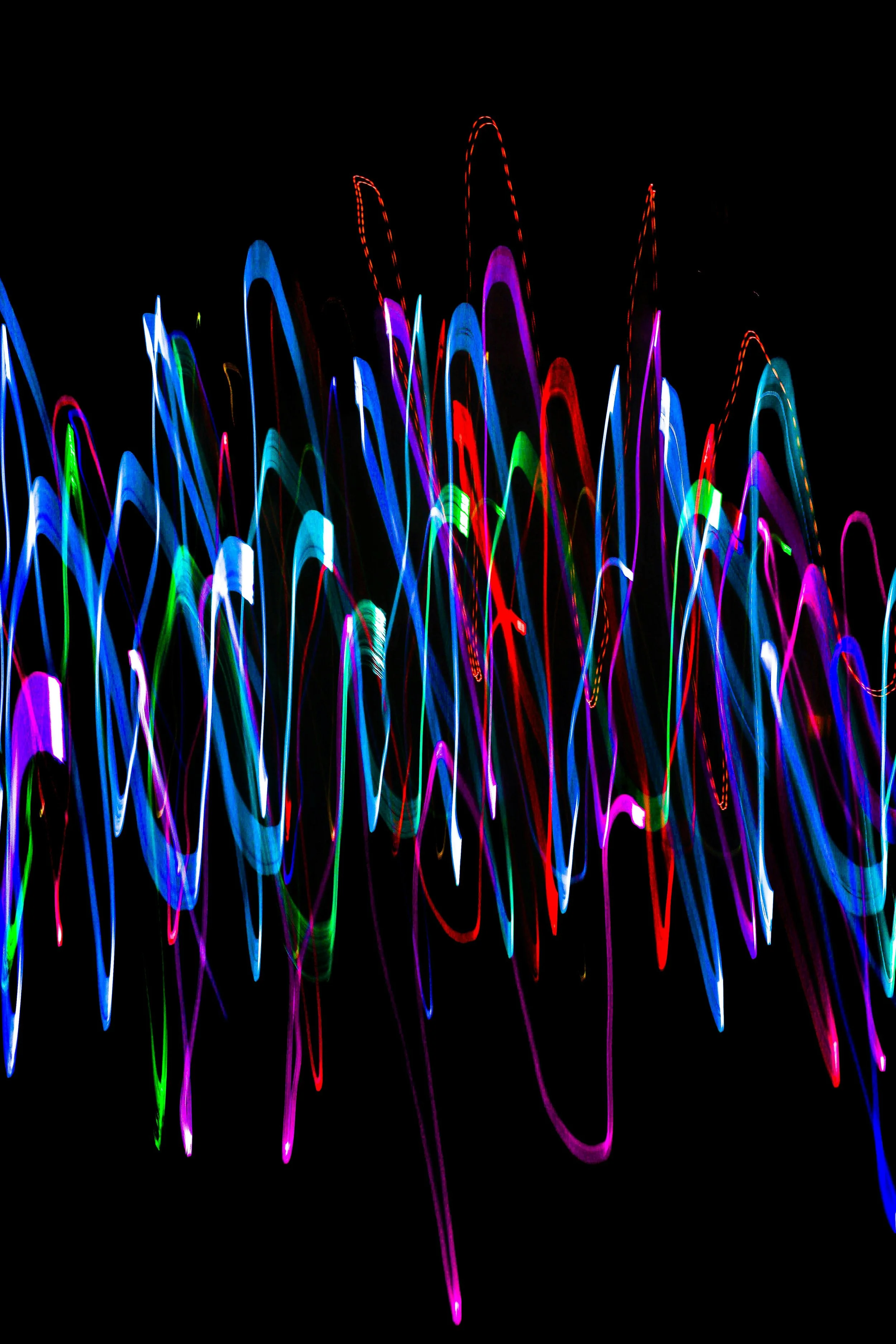 Overlapping Neon Sound Waves on Black Background