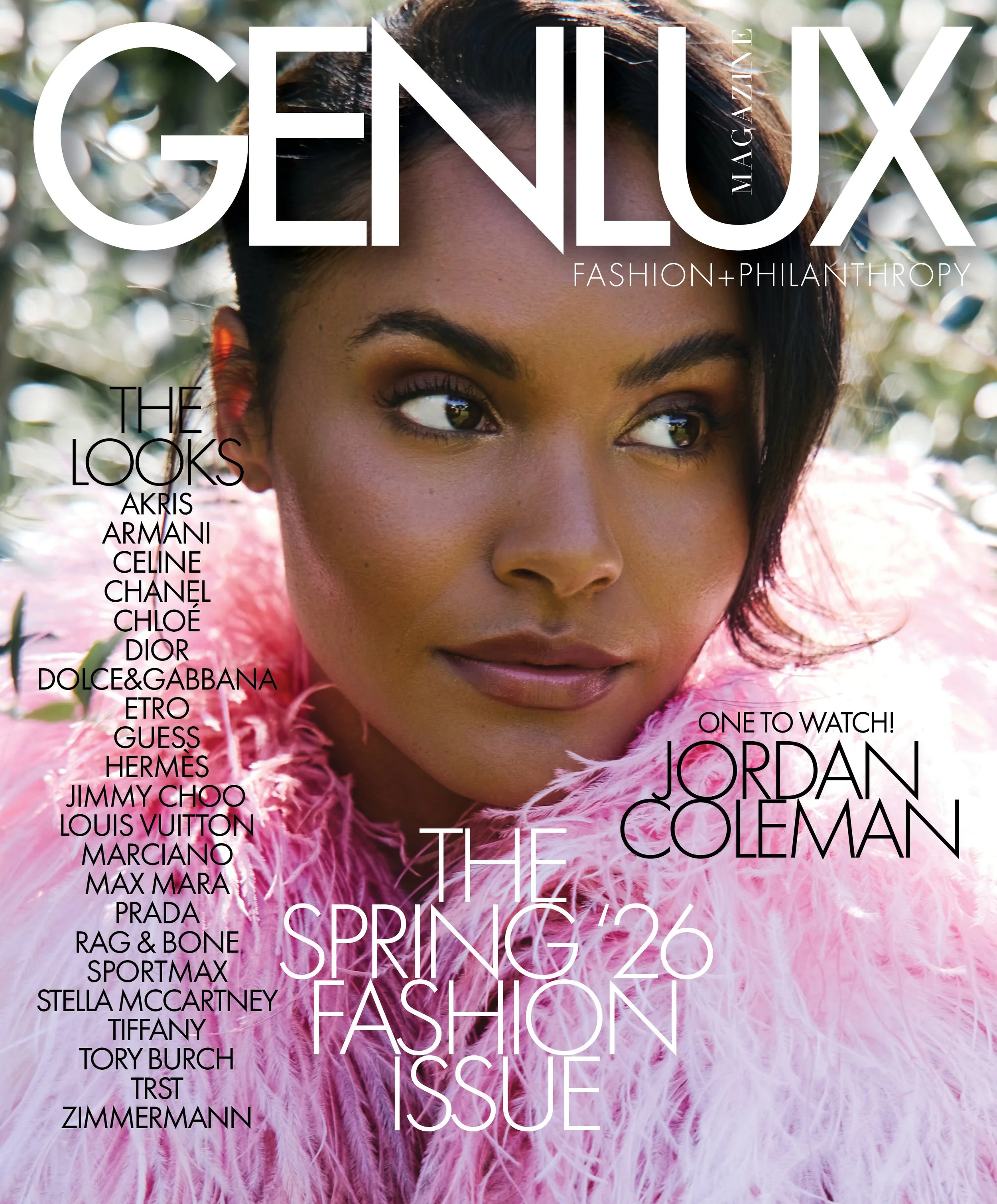Close-up of a woman with dark hair and brown eyes, wearing pink feathered clothing, outdoors with blurred greenery in the background. The image overlays text about fashion magazine issues and brands.
