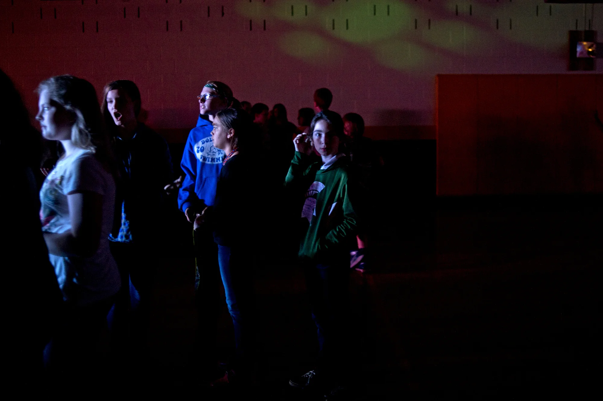  Sophie brushes back her hair during the Bullock Creek Middle School Halloween Dance on Oct. 29 in Midland, Mich. 