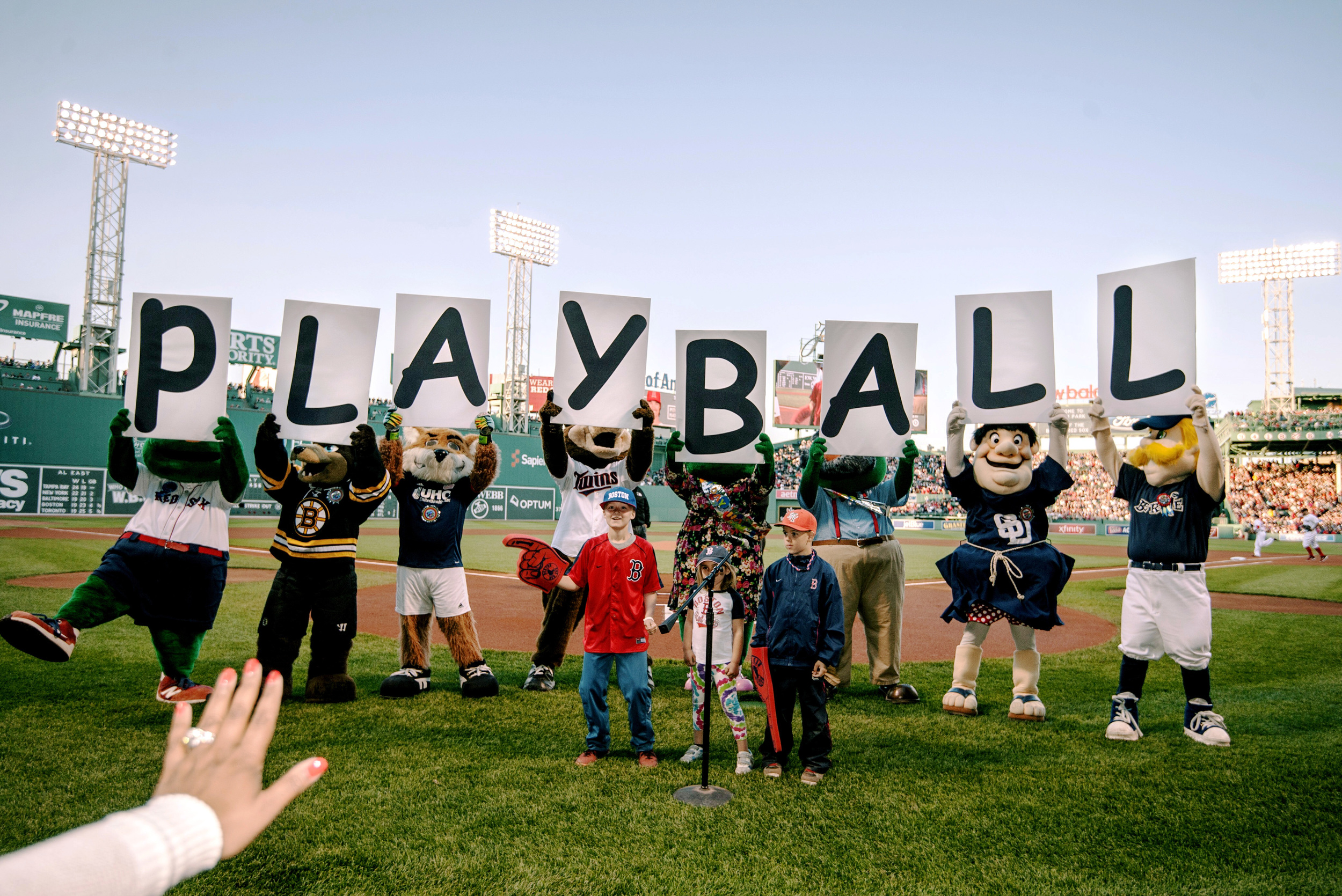 Fan Services Coordinator Nina Gomez motions for all mascots to hold their signs and stay in their positions during the pregame ceremonies of the Boston Red Sox vs. Los Angeles Angels game on Saturday, May 23, 2015 at Fenway Park in Boston, Mass. 