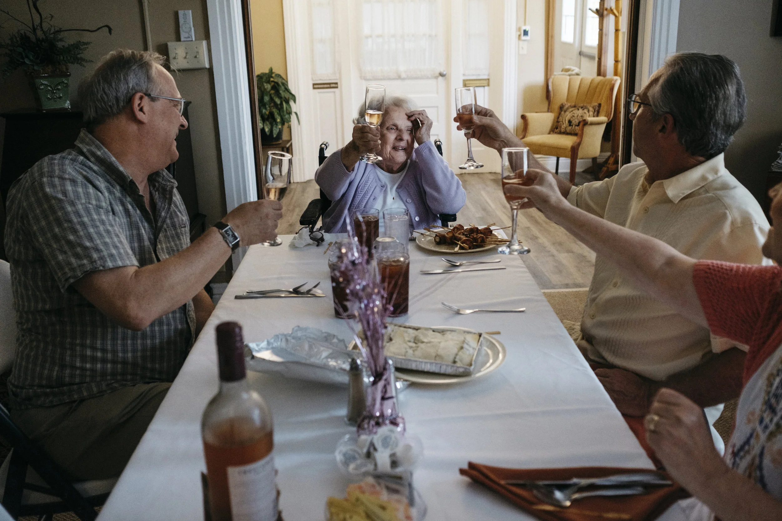  Virginia Buckner toasts to her 92nd birthday alongside sons John Buckner, left, Chuck Buckner, right, and daughter-in-law Cindy Buckner during a luncheon on Sunday, June 16, 2019 at King's Daughters Home in Mexico, Mo. "Not bad for a country girl," 