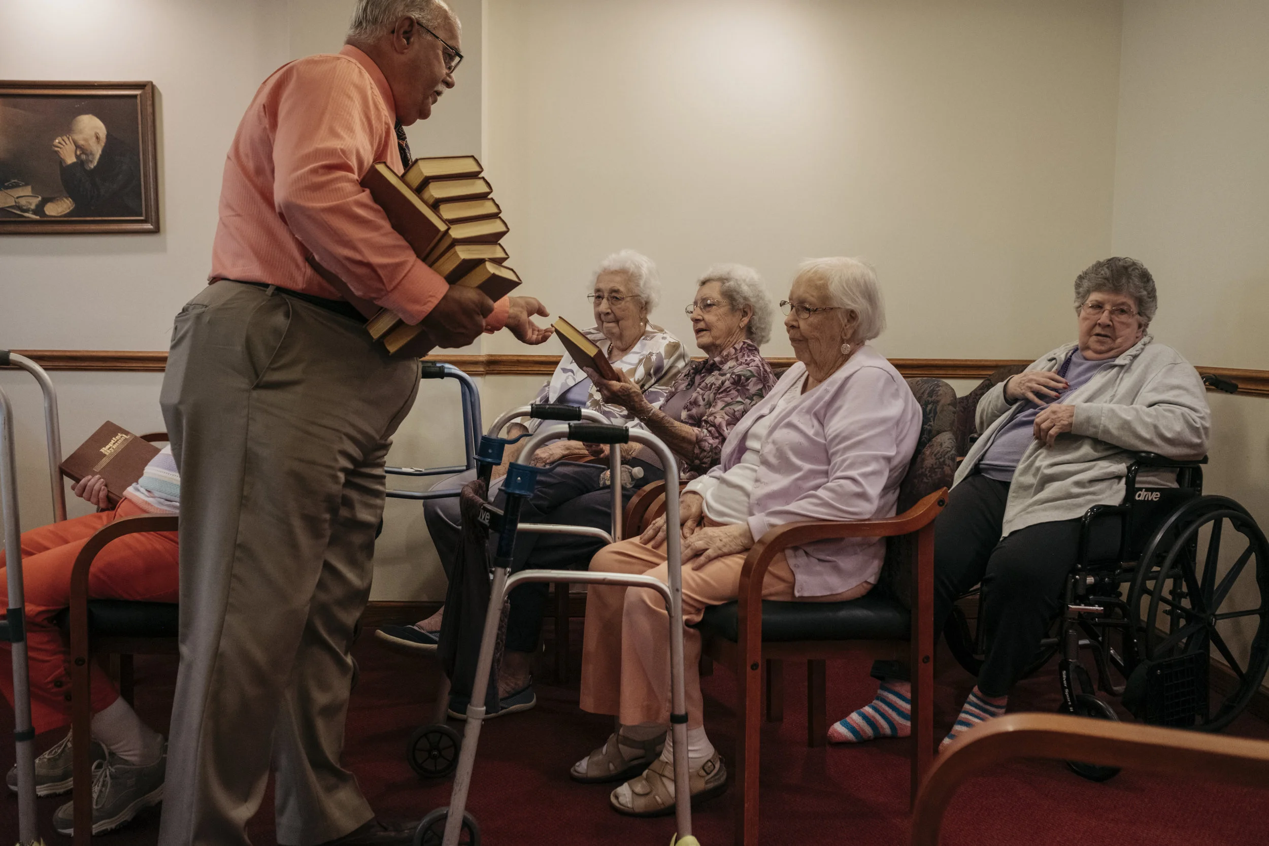  Friendship Baptist Church Pastor Glenn Forman hands out hymnals before church service on Sunday, June 16, 2019 at King's Daughters Home in Mexico, Mo. Various local churches take turns traveling to the home's chapel for weekly mass and Bible study. 