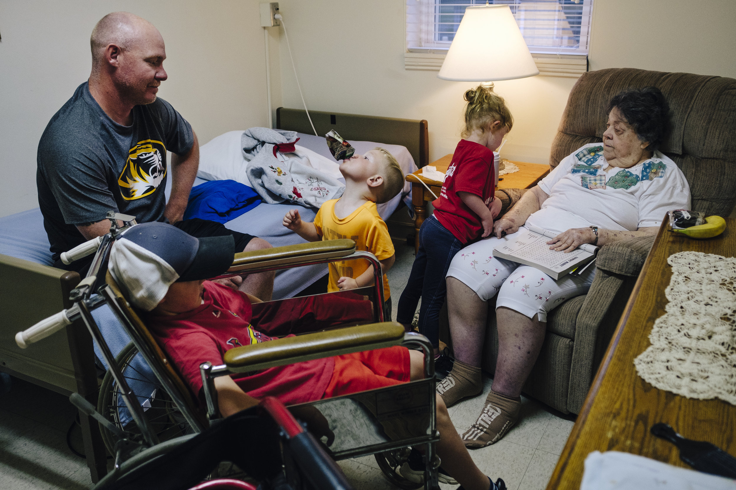  Justin Myers, left, and his children Landon, 6, Hudson, 2, and Cora, 4, visit his grandmother Wynema Myers, 83, on Monday, June 17, 2019 at King's Daughters Home in Mexico, Mo.  