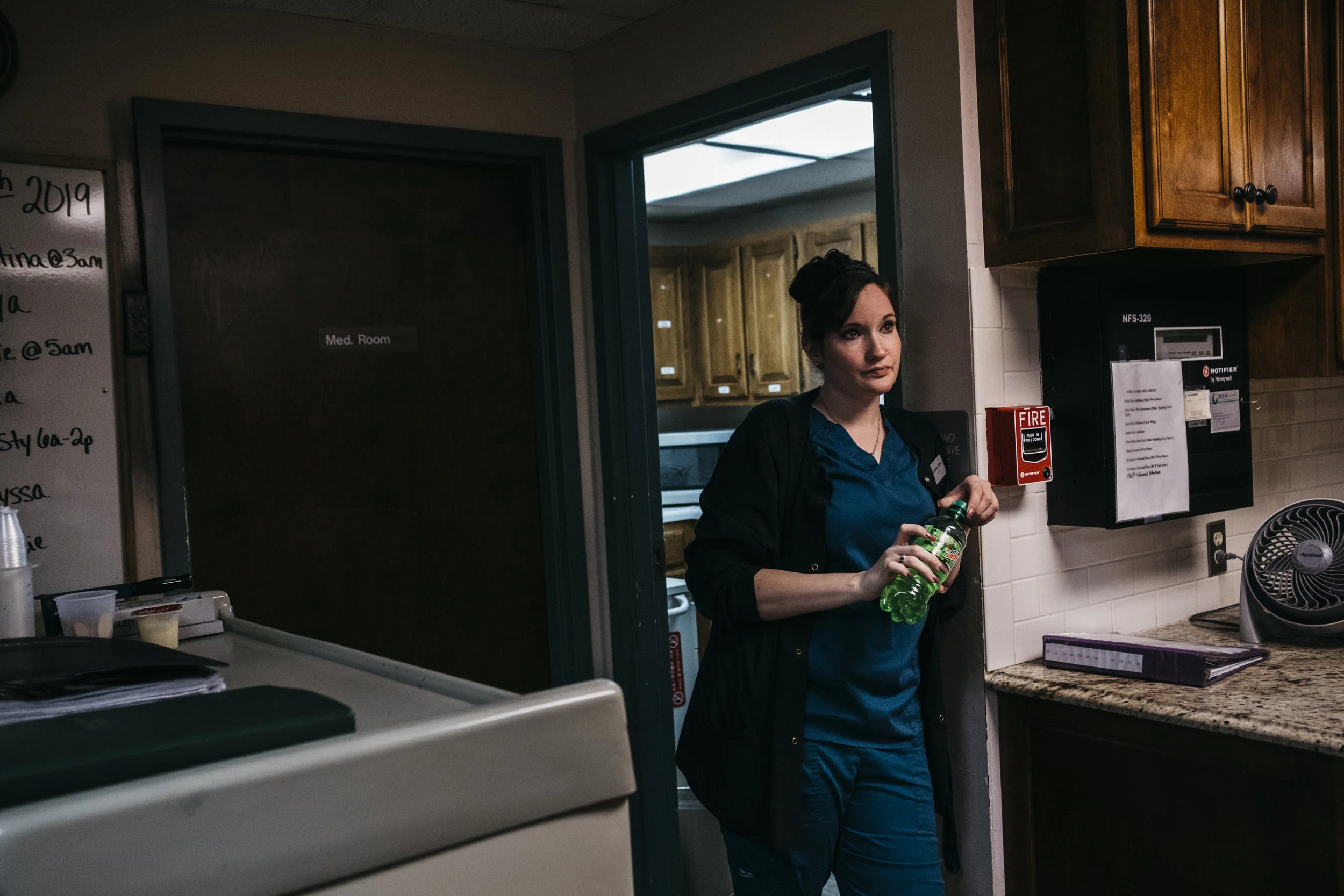  Director of Nursing Kristina Miller catches her breath after morning medication rounds on Thursday, June 20, 2019 at King's Daughters Home in Mexico, Mo. A single mother of two, Miller has been working longer hours since her daytime nurse recently q
