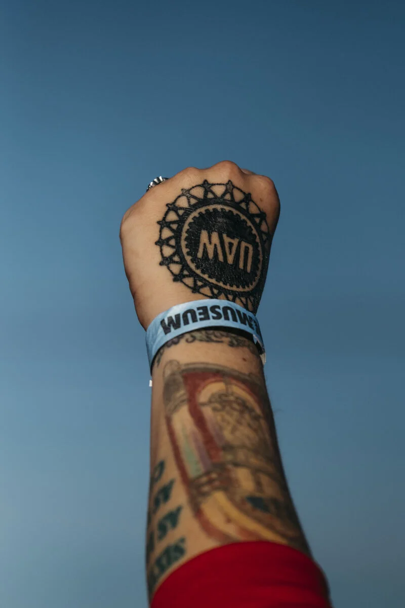  General Motors employee of 3.5 years Melissa Bowen, 32, of Burton raises her hand while picketing outside the General Motors Flint Engine Operations Plant during the 11th day of the strike on Thursday, Sep. 26, 2019 in Flint, Mich. Although she had 