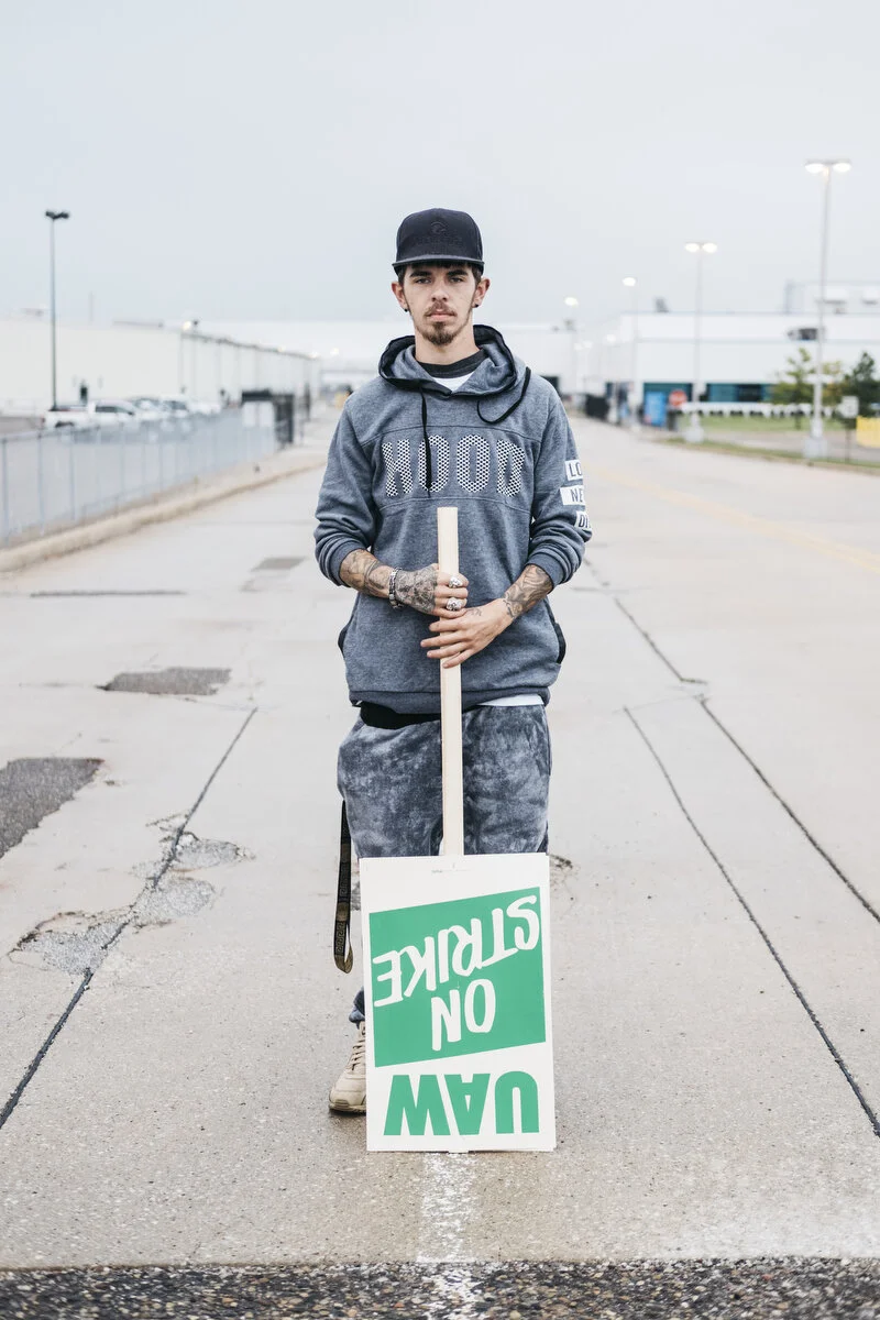  General Motors temp employee Tyler Miller, 28, of Flint stands for a portrait outside the Flint Assembly Plant on Monday, Sep. 16, 2019 in Flint, Mich. After the current bargaining contract expired on Saturday, nearly 50,000 U.A.W. General Motors em