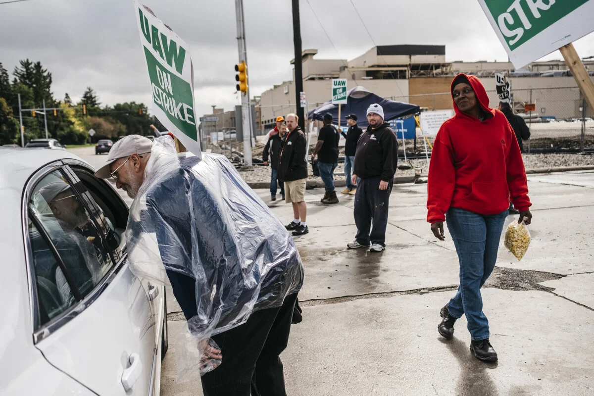  UAW members and supporters picket outside the General Motors Flint Assembly Plant during the 18th day of the strike on Thursday, Oct. 3, 2019 in Flint, Mich.  
