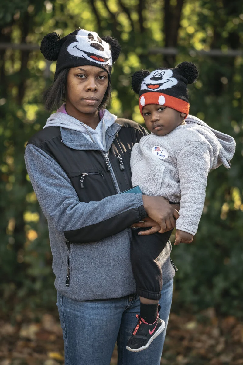  GM temporary employee and UAW Local 598 member Leronda Vines, 33, of Davison and daughter Mariah Kellum, 2, stand for a portrait after voting on the new contract at Union City Fields on Wednesday, Oct. 23, 2019 in Flint, Mich. Vines voted against th