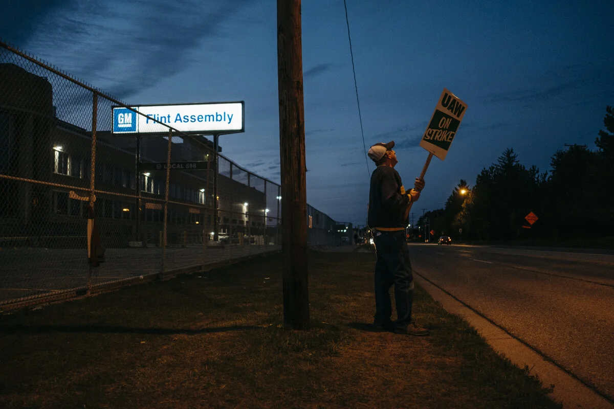  A man who wishes to remain unidentified pickets outside the General Motors Flint Assembly Plant during the 25th day of the strike on Thursday, Oct. 10, 2019 in Flint, Mich.  