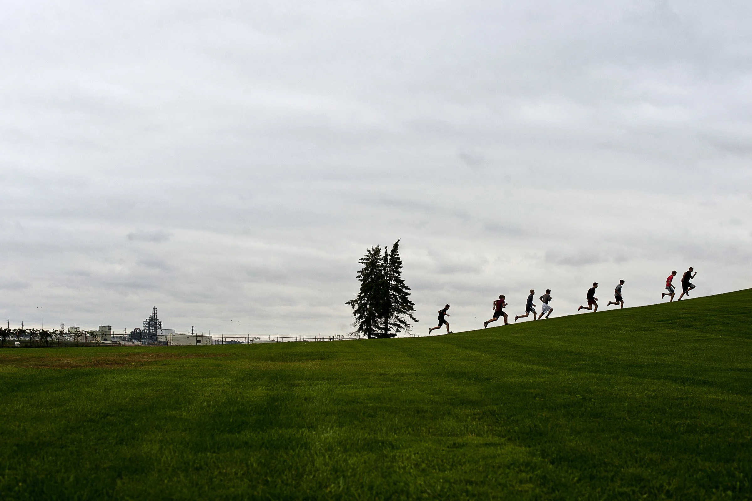  The Bullock Creek Cross Country team runs up and down the hill at Overlook Park to start practice on Thursday. The girls and boys teams have run the hill a handful of times this season as a strengthening exercise. 