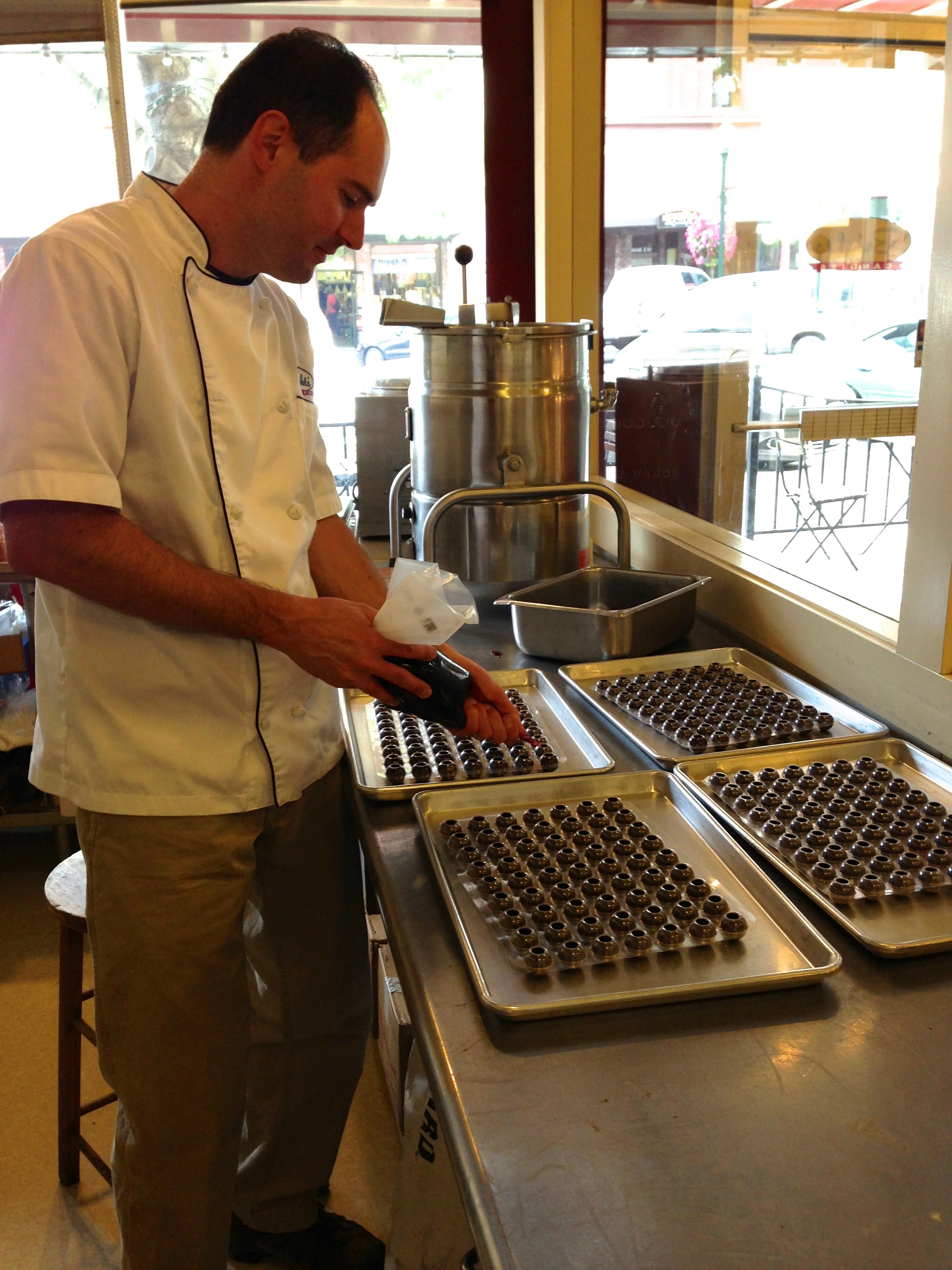 In the candy kitchen-viewing windows to the store and outside