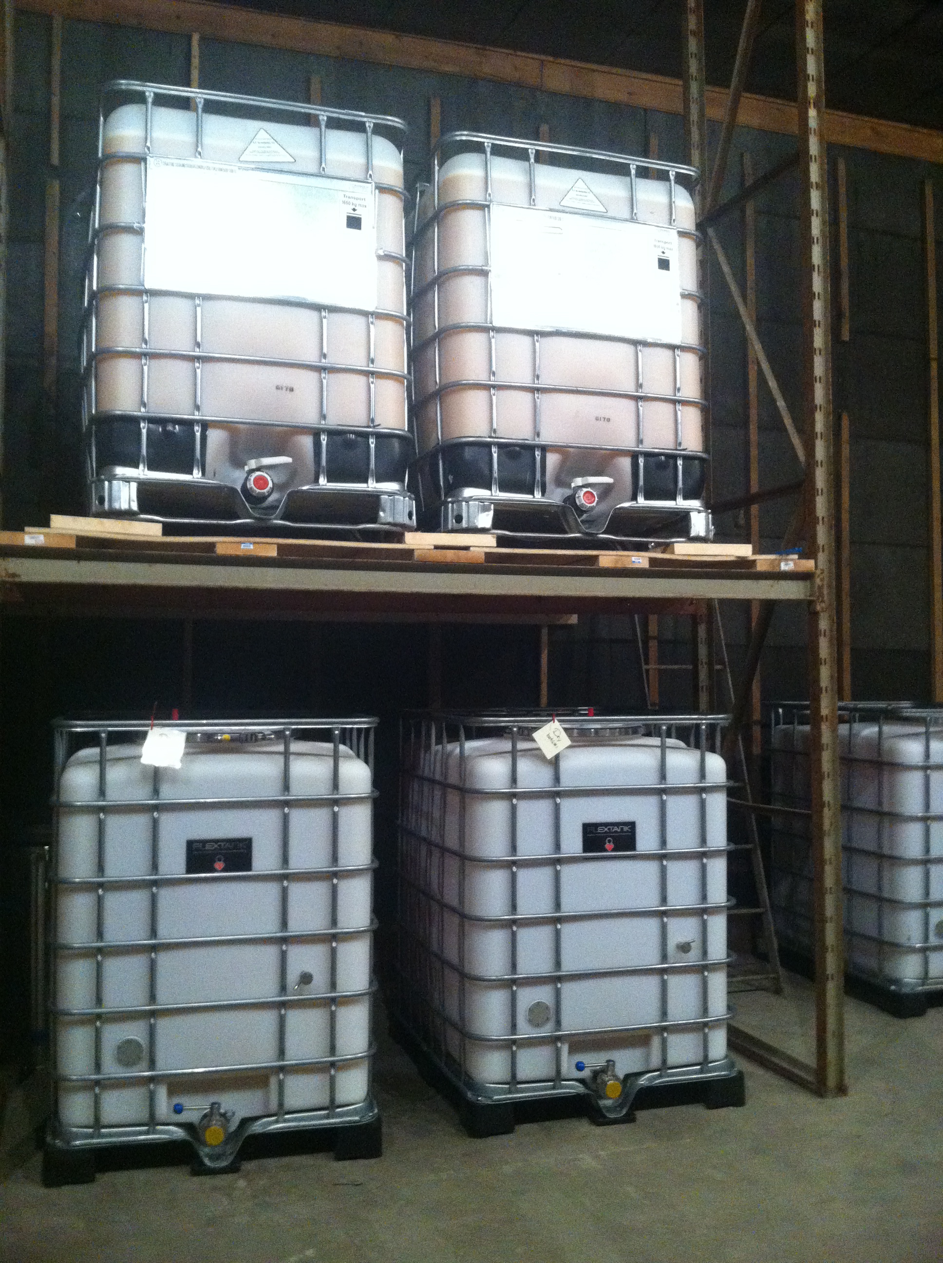Containers full of fermenting cider.