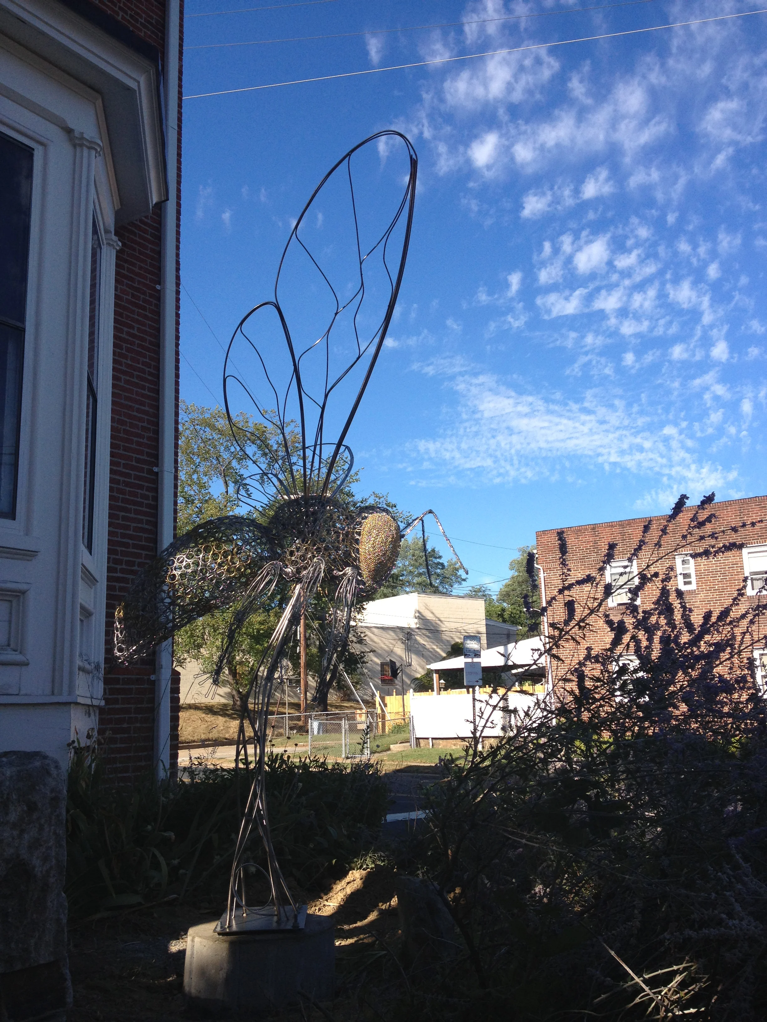 10 foot tall, stainless steel and brass, honeybee sculpture on the corner of 41st and Druid Park Drive in Baltimore City.