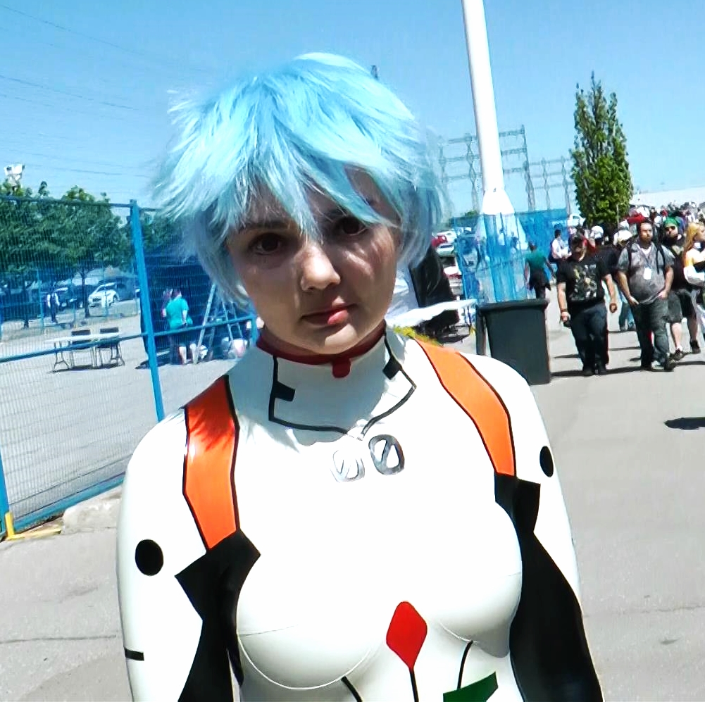 It's Rei Ayanami from Evangelion. It's hard to see but her red contacts really stuck out to us in the crowd, not to mention her custom made awesome looking latex body suit.&nbsp; 