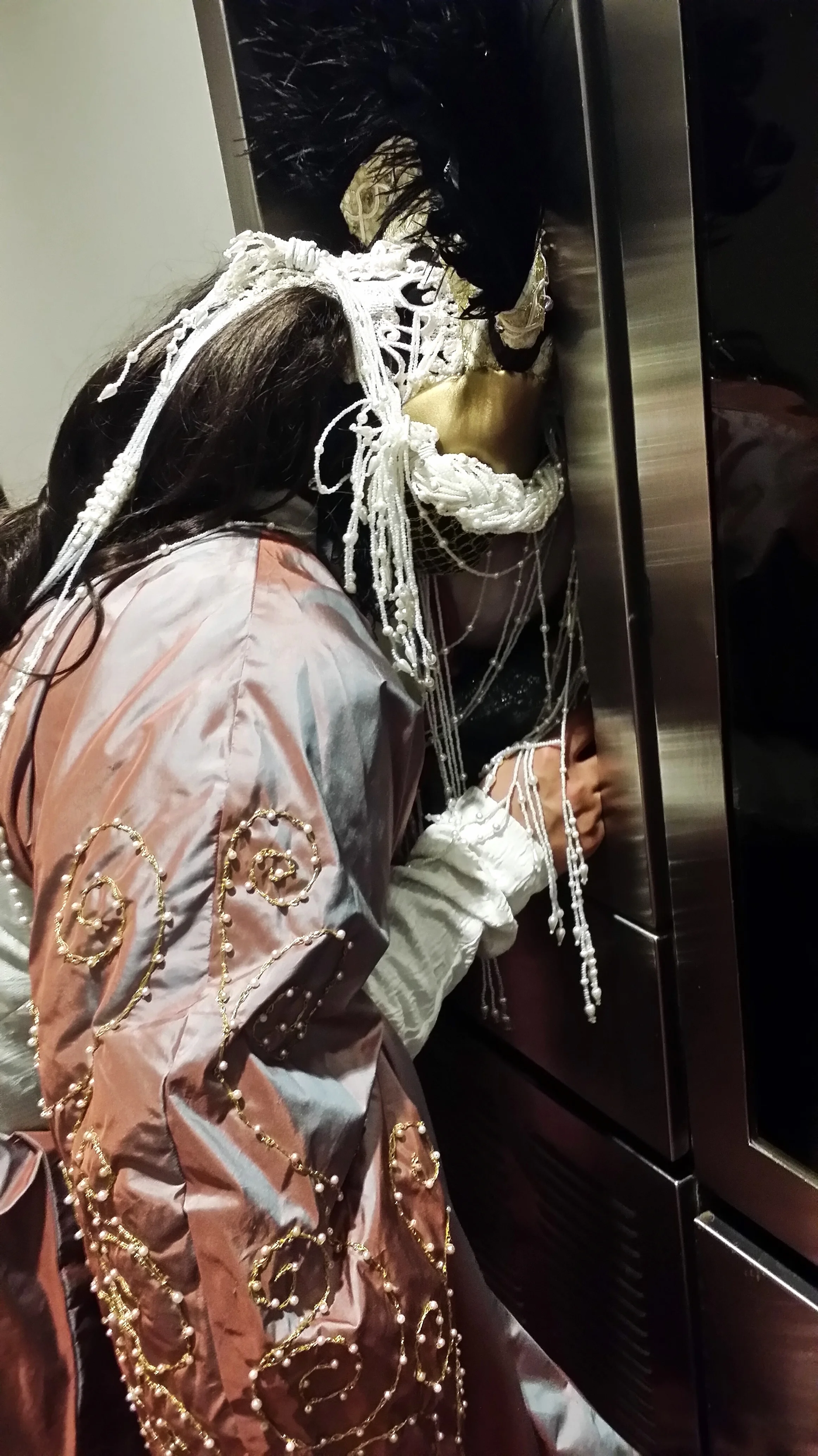 This picture was my struggle of trying to use the drinking fountain with all my pearls and feathers getting in the way. 