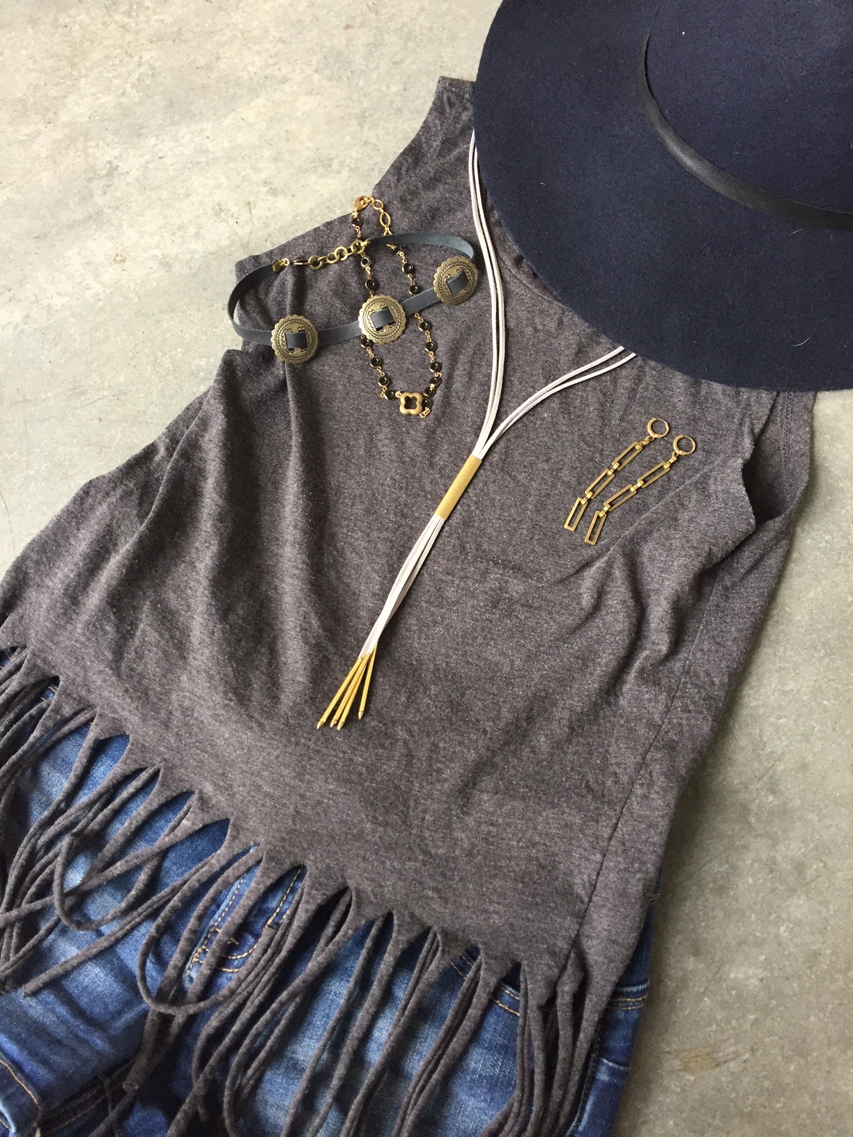 Chokers, Bolos, and dangle earrings paired with a fringe crop top and cut offs. 