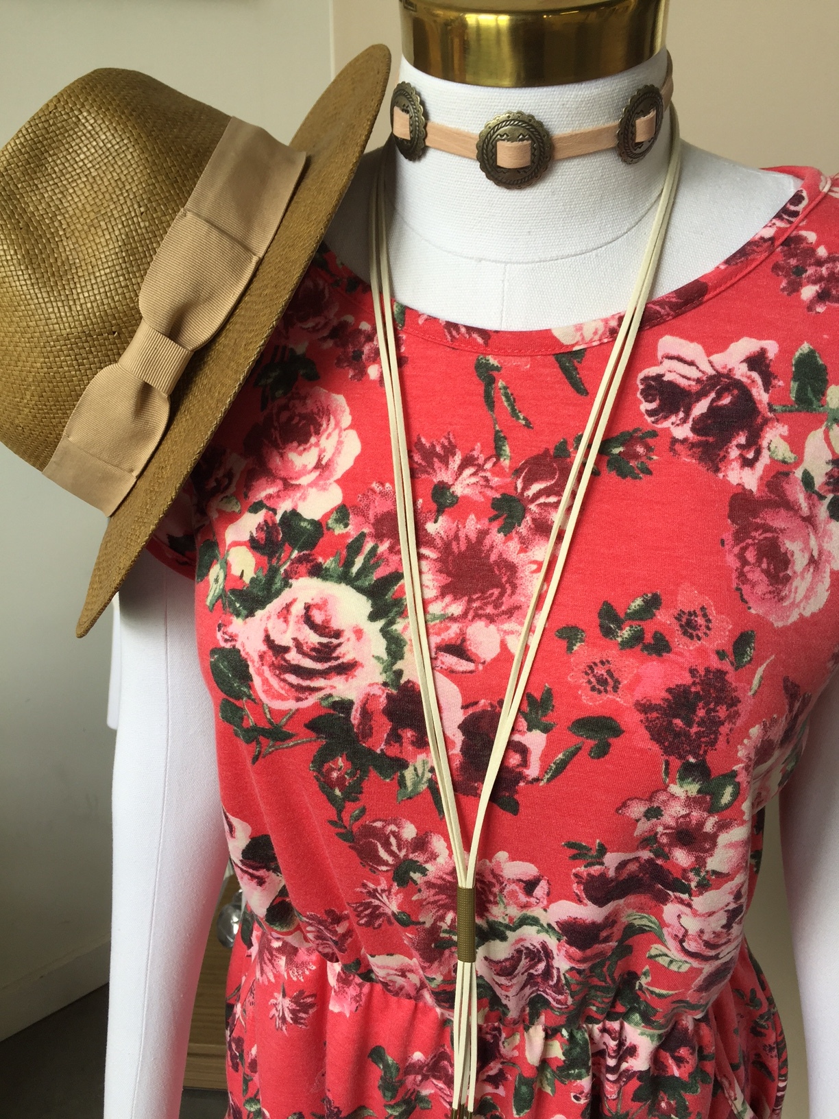 If a bit more color is what you're looking for, try a floral romper with a bolo and western inspired choker.