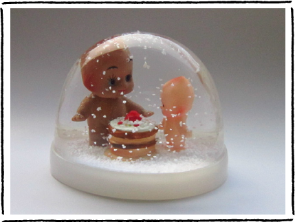 The Kewpie and Cake snowglobe. Buy it here .