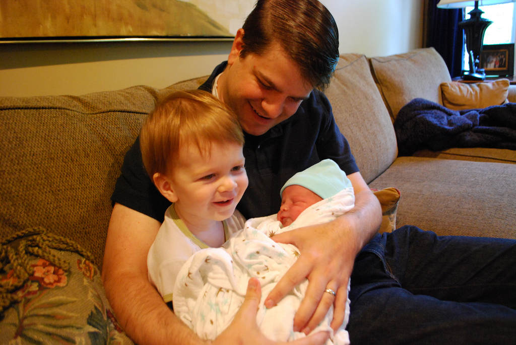 Amos swaddled in his brother's Aden + Anais swaddle blanket. 