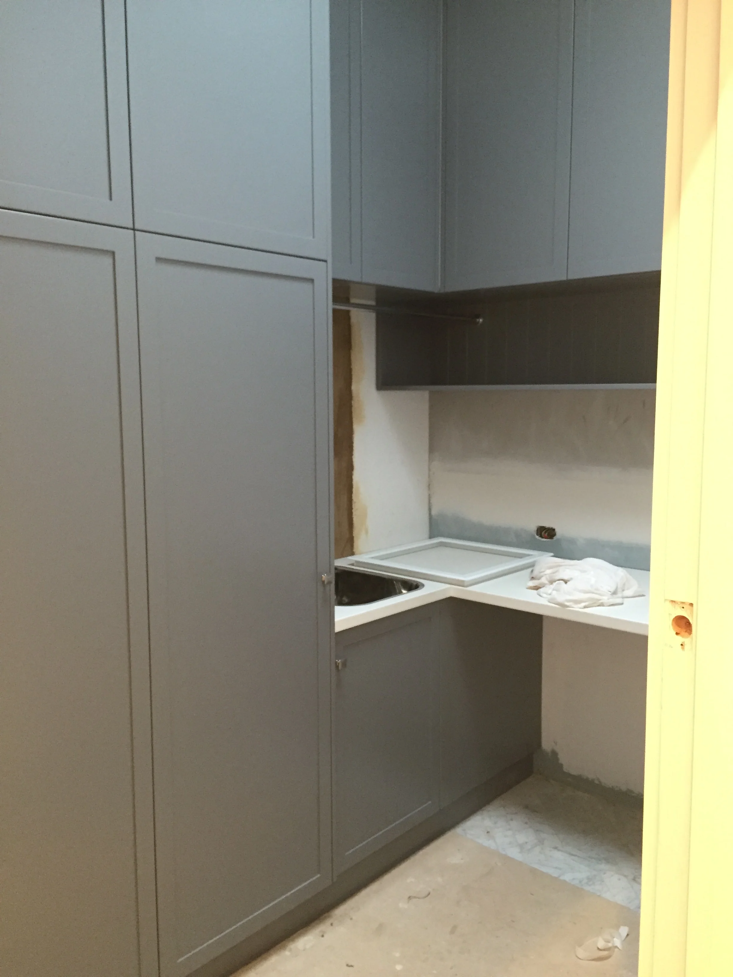 New laundry going in. Skylight makes the room incredibly light. Need to see it with the cute chrome handles.