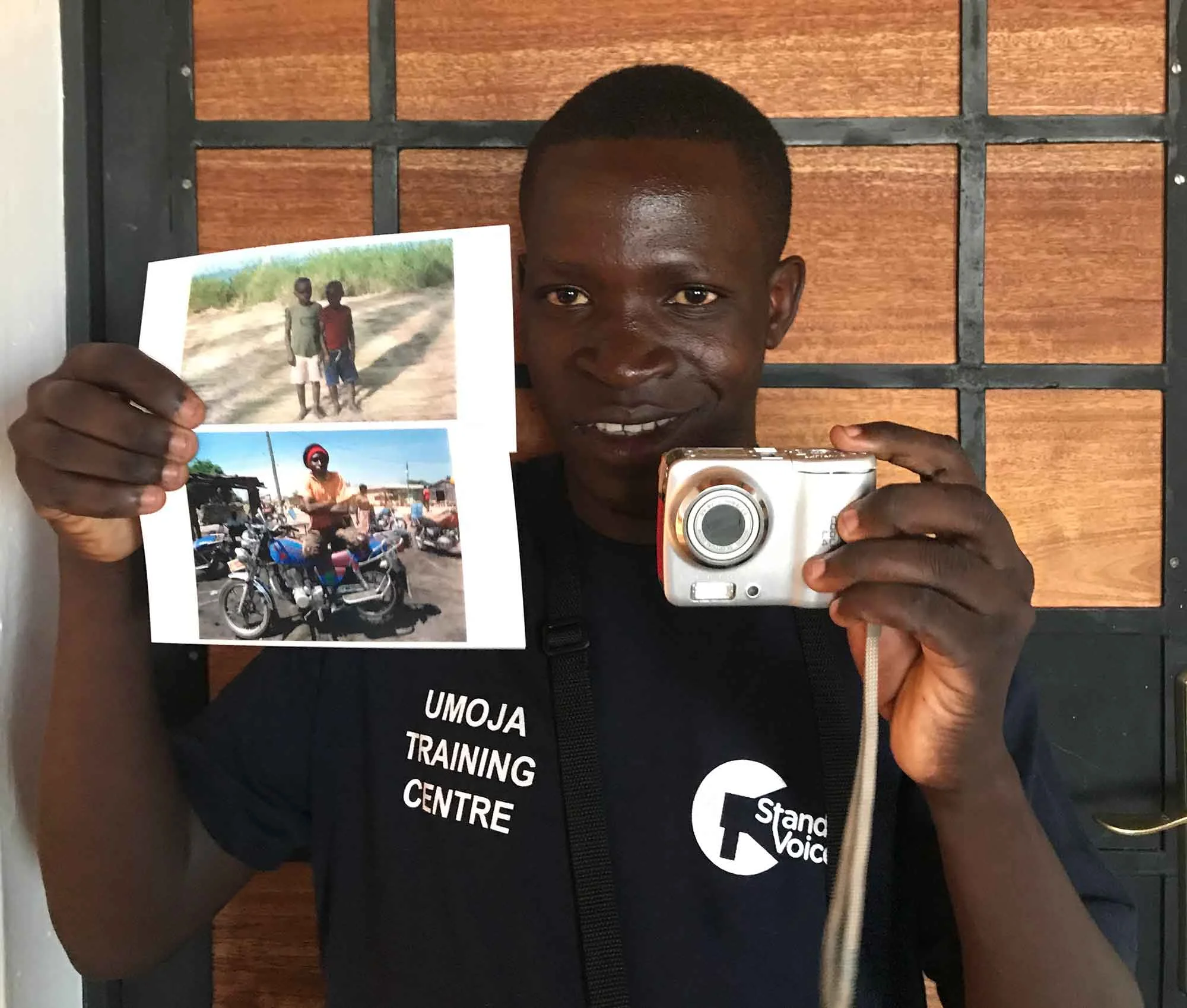 Kajala holding his selected photos for the doner of his camera. Camera donated by @Parysa_P from Tehran/Iran