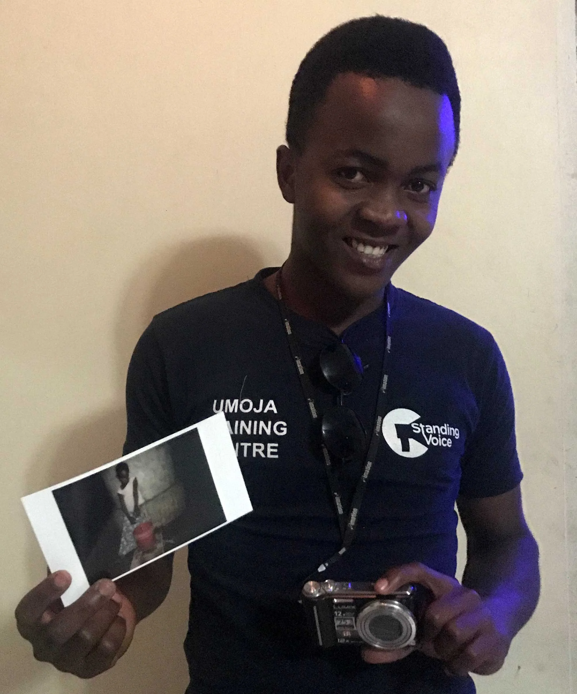 Ayub holding his selected photo for the doner of his camera. Camera donated by @mehrdan from Tehran/Iran