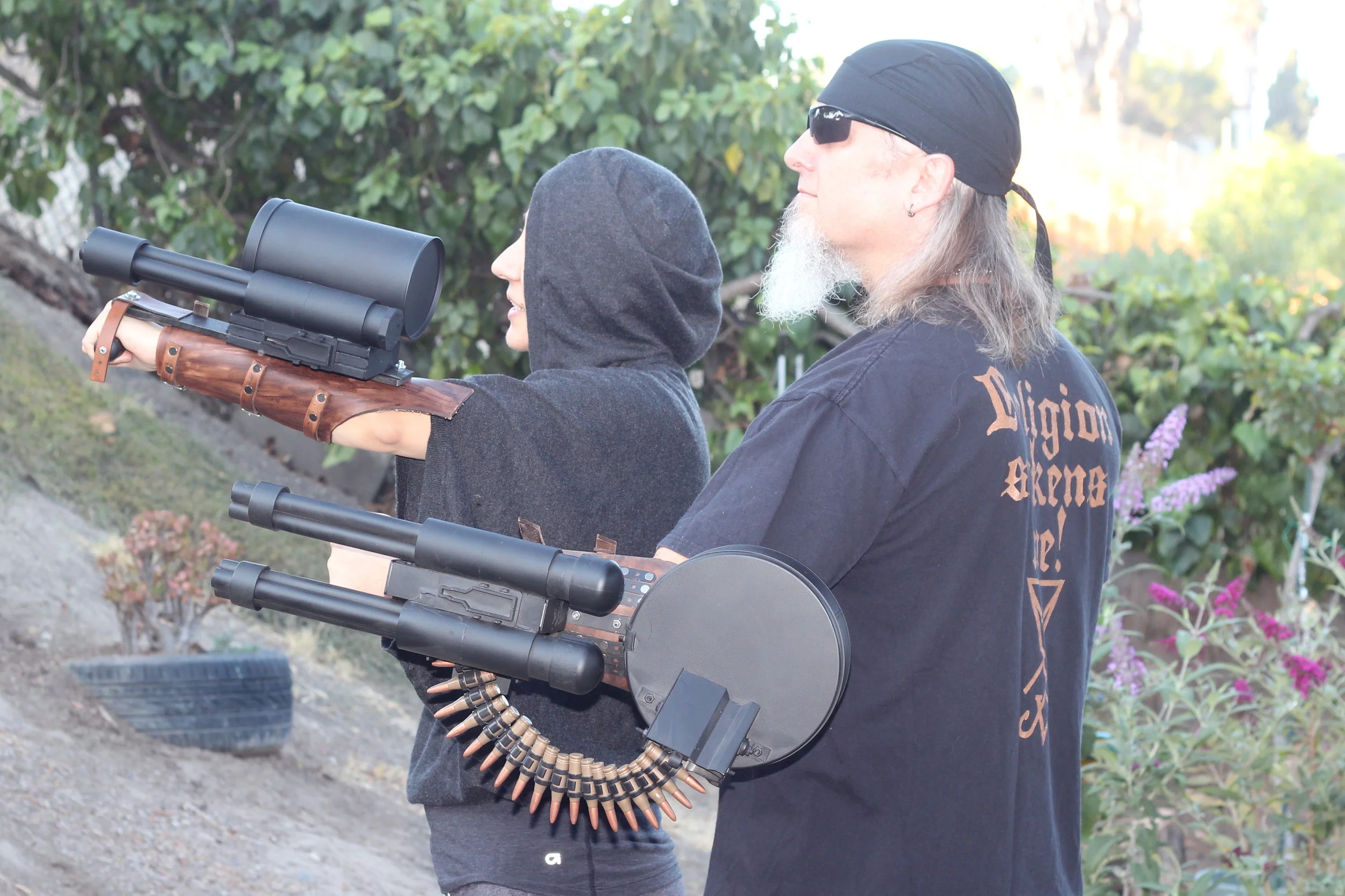 His & hers arm mounted mini guns