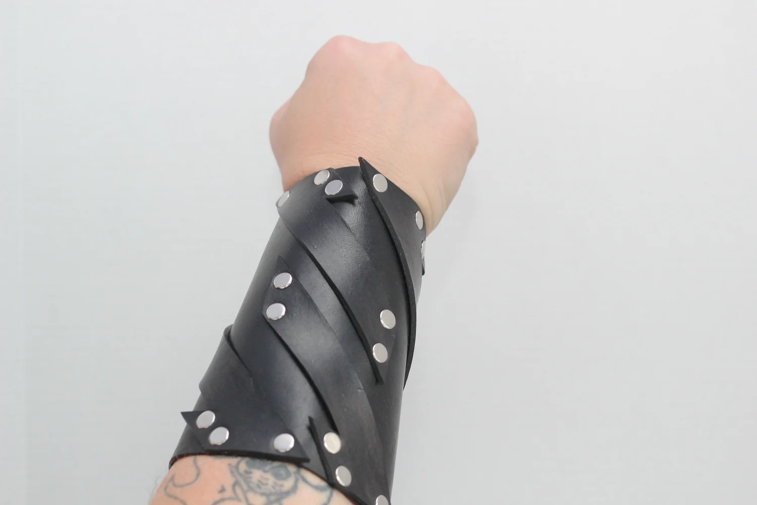 Black leather bracer with abstract strap design — Bjorkman
