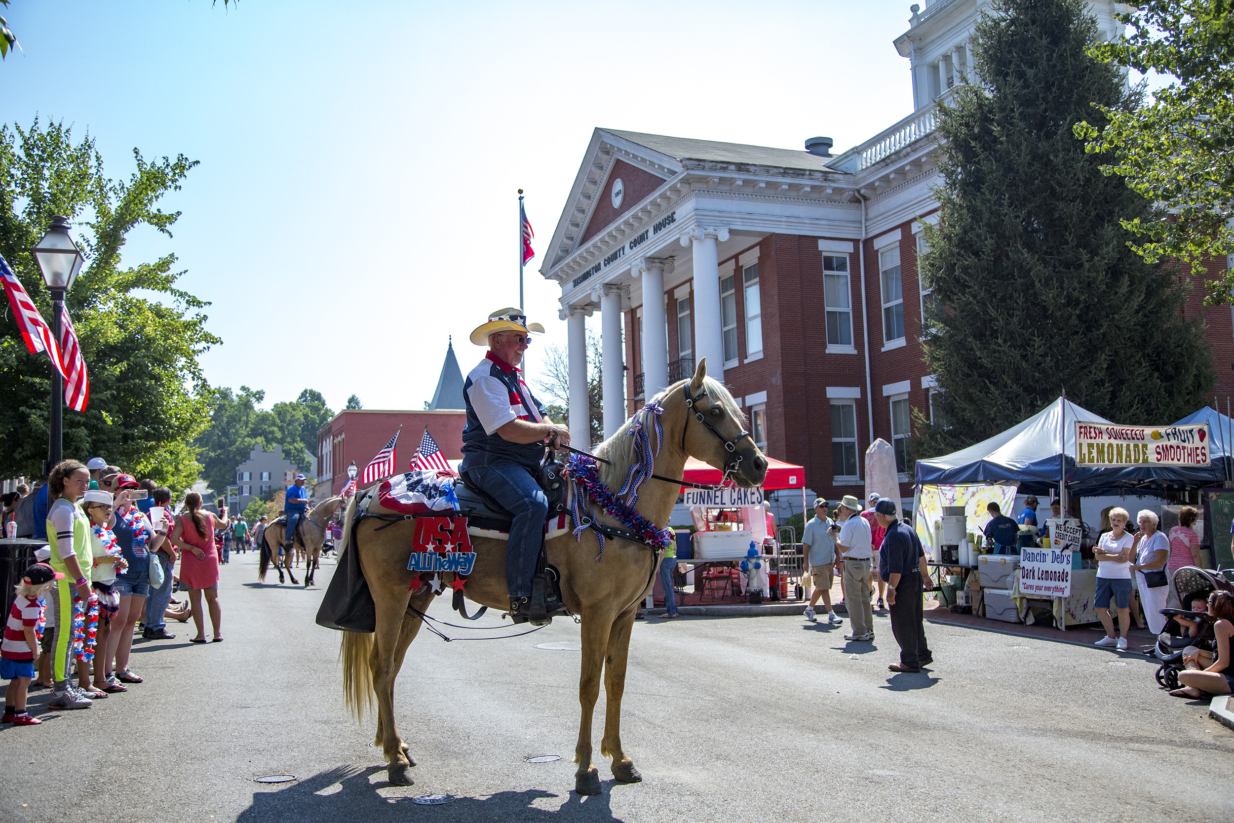 A man and horse pose for the camera.