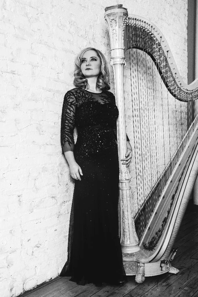 Three principles that have shaped my musical life and career: 1| Work as hard as you can when you have the time! I'm all for a great vacation, especially somewhere warm during our long Chicago winters, but absolutely believe the harder you work the more luck you will have in your career. 2| Always have a goal in mind. This includes learning and performing music for concerts, auditions and competitions, as well as thinking about ways the harp could evolve in my life. I'm a 'Project Person' and love a good challenge. Some of these projects have included the creation of the Chicago Harp Quartet and Chicago Harp Ensemble, publishing over 100 works for harp, and a solo Christmas CD. 3| Stay organized! I currently have four jobs (Private teaching, Roosevelt University, Chicago Harp Quartet and Lyric Opera of Chicago), each one of those has its own set of requirements and keeping everything organized is a must! How did you find your way to the harp? I come from a musical family. Both my sisters and I studied piano starting at 5 years old. Throughout school I tried many other instruments, but it wasn't until I was 14 that I had the opportunity to try the harp and instantly fell in love with it. My mother had always dreamed of playing the harp (she played piano and later became a music educator in public schools) but her family could not afford one. When her mother passed away, she left money earmarked for the purchase of a harp. That harp still sits in my studio today, in fact I played the Brahms German Requiem on it last week! What do you enjoy doing when you're not behind a harp? I truly enjoy traveling and exploring foreign culture. My husband and I finally went on our honeymoon this past July and on the flight back made a list of all the places in the world we need to see. This year we'll be heading to Puerto Rico for a little Winter thaw-out, and to Thailand in the Spring. I'm also trying to organize a Dude Ranch vacation with my two sisters! I love cooking when I have the time (which is't that often). Being raised a good Southern Lady, I love to make traditional Southern dishes, but also like to branch out into other ethnicities. Recently I discovered Delicata Squash and am currently obsessed with it! Finally, my husband Donald and I welcomed an 8 week old puppy named Dante into our home this past August. Dante is a solid black American Cocker Spaniel who loves to get into all sorts of trouble! Both Donald and I grew up with Cockers and are so happy to finally have our own! Lately our favorite outings have included going to one of the many City of Chicago dog parks where Dante races around keeping up with all the rather large dogs.