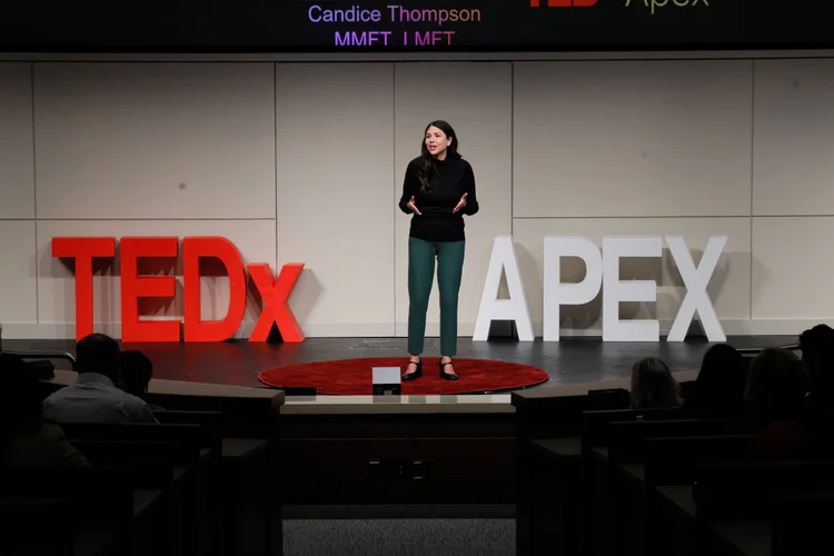 Candice Thompson on stage at TEDx Apex 2025