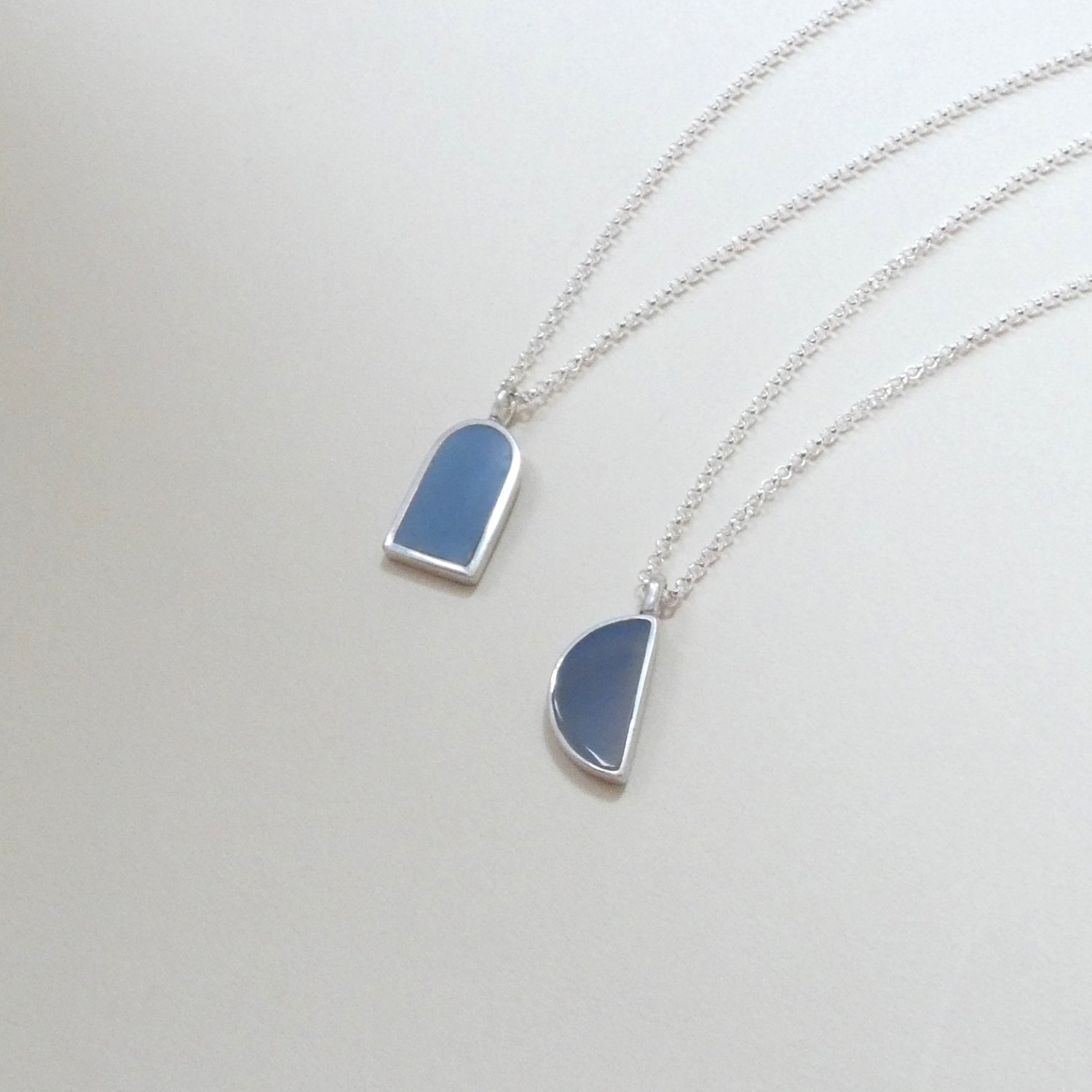 2 pendants gray blue jade half moon and archway.JPG