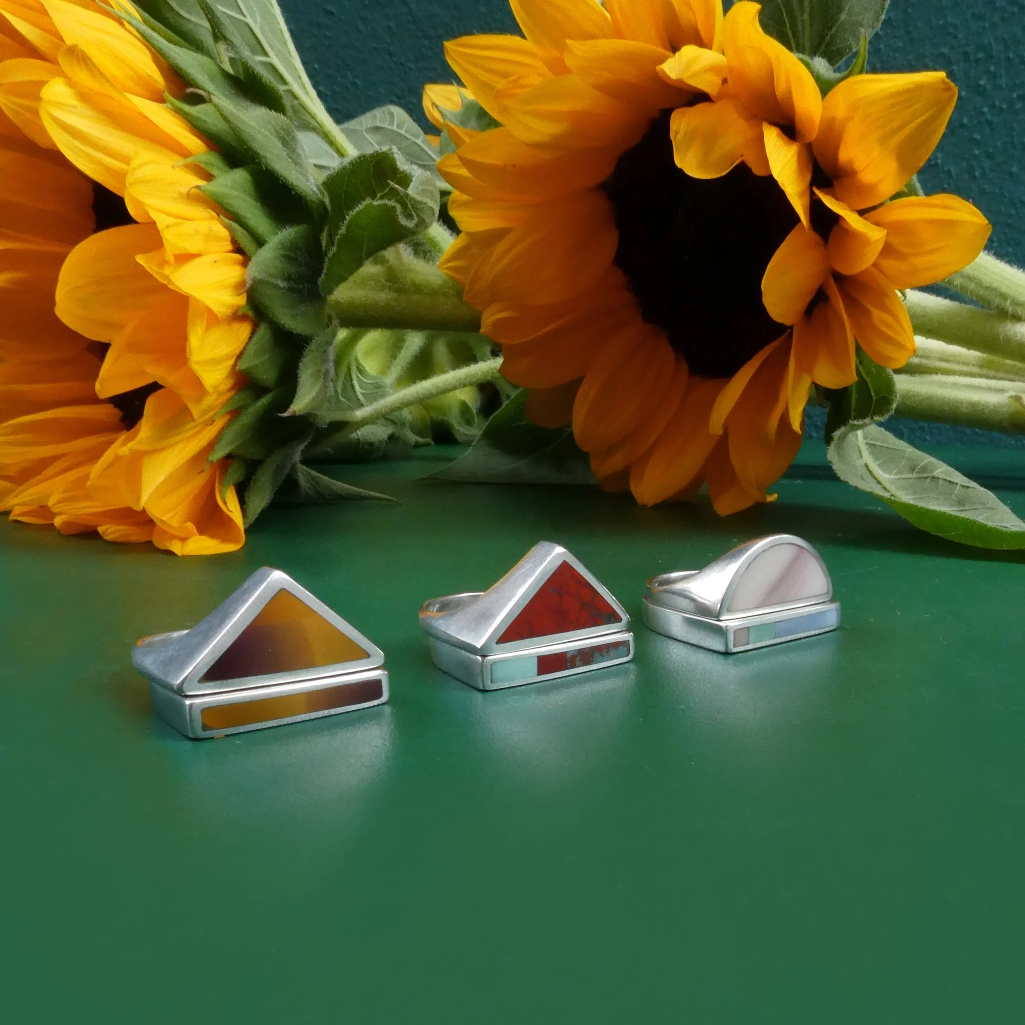 3 ring stacks on green with sunflower.JPG