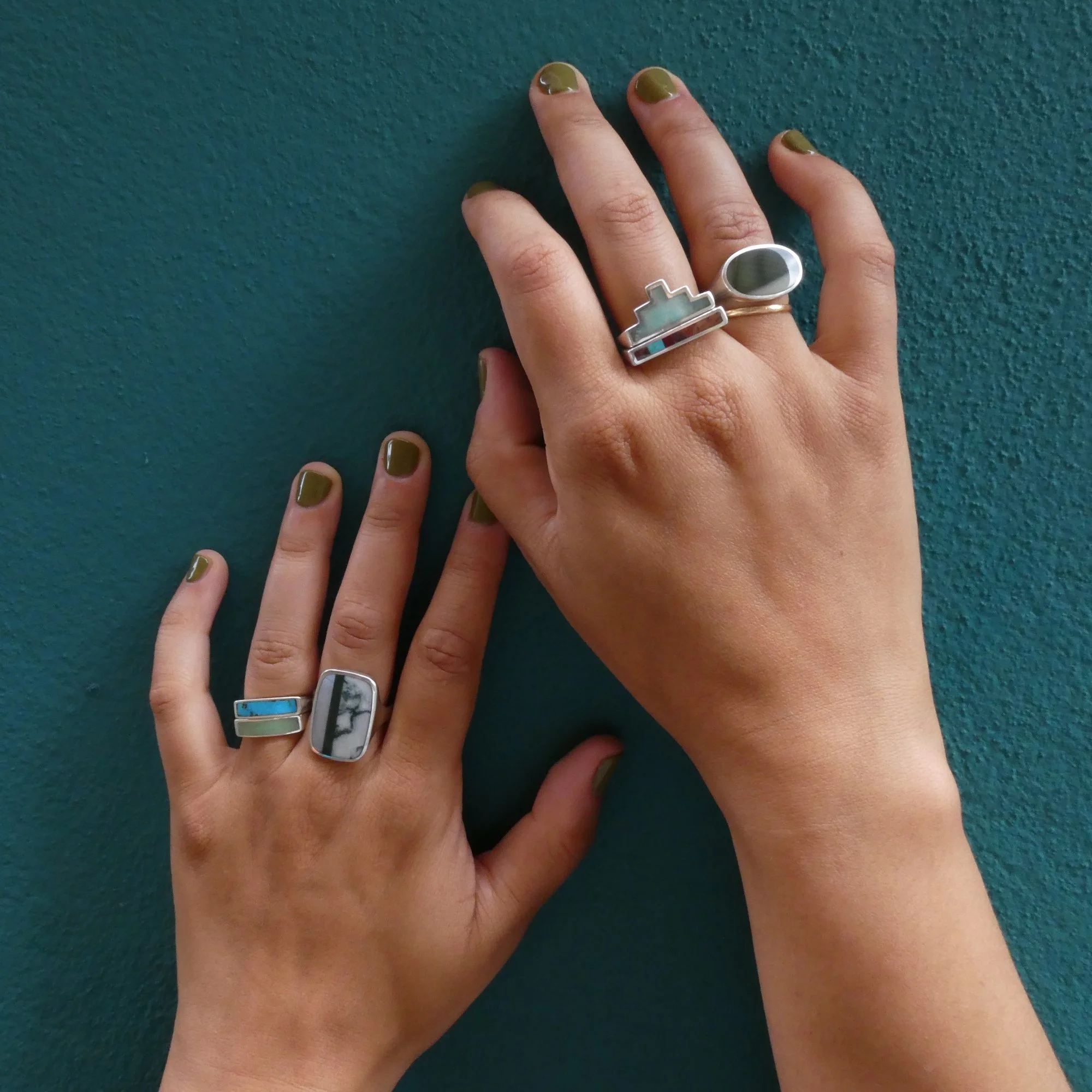hands 2 on teal background with rings.JPG