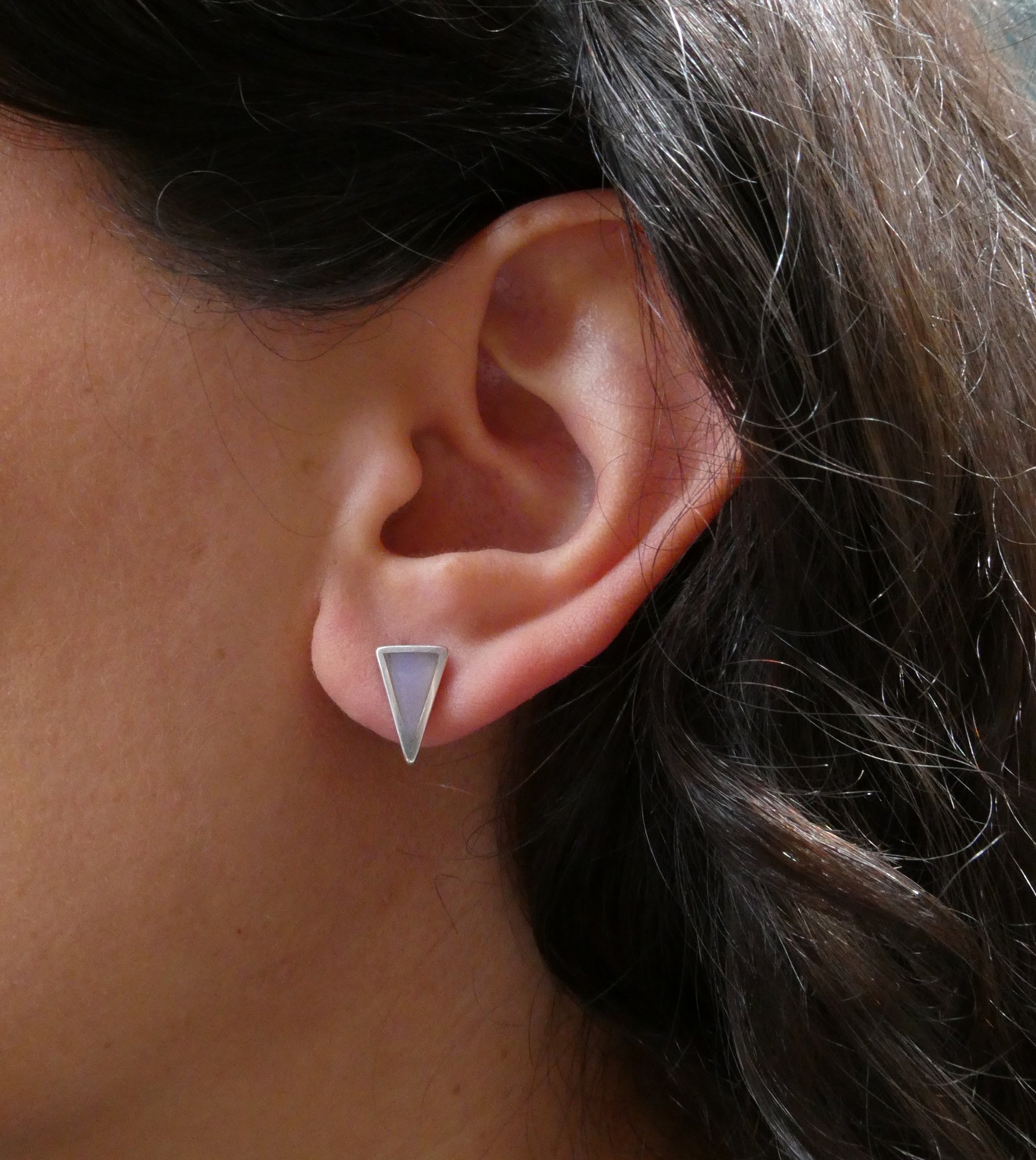 triangle studs on ear.JPG