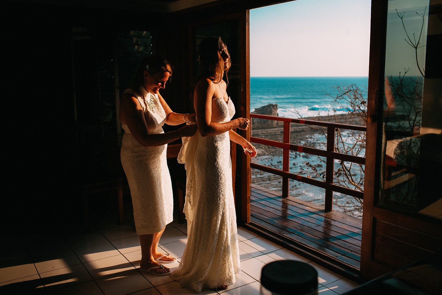Mother helping the bride before her beach wedding. Popoyo, Nicaragua