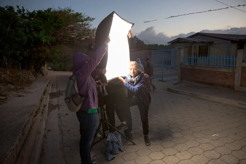 5 am. The wind appeared to be brutal that day. My friends from Fabretto Marketing Team struggling against heavy gusts of wind while helping me to sustain the lights. Thanks girls!!