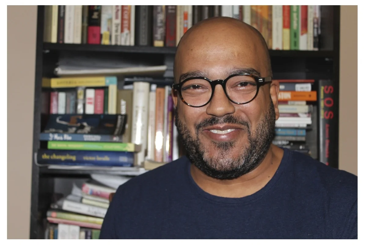 Preview of “Author Photo Bookcase 1.JPG”.jpg