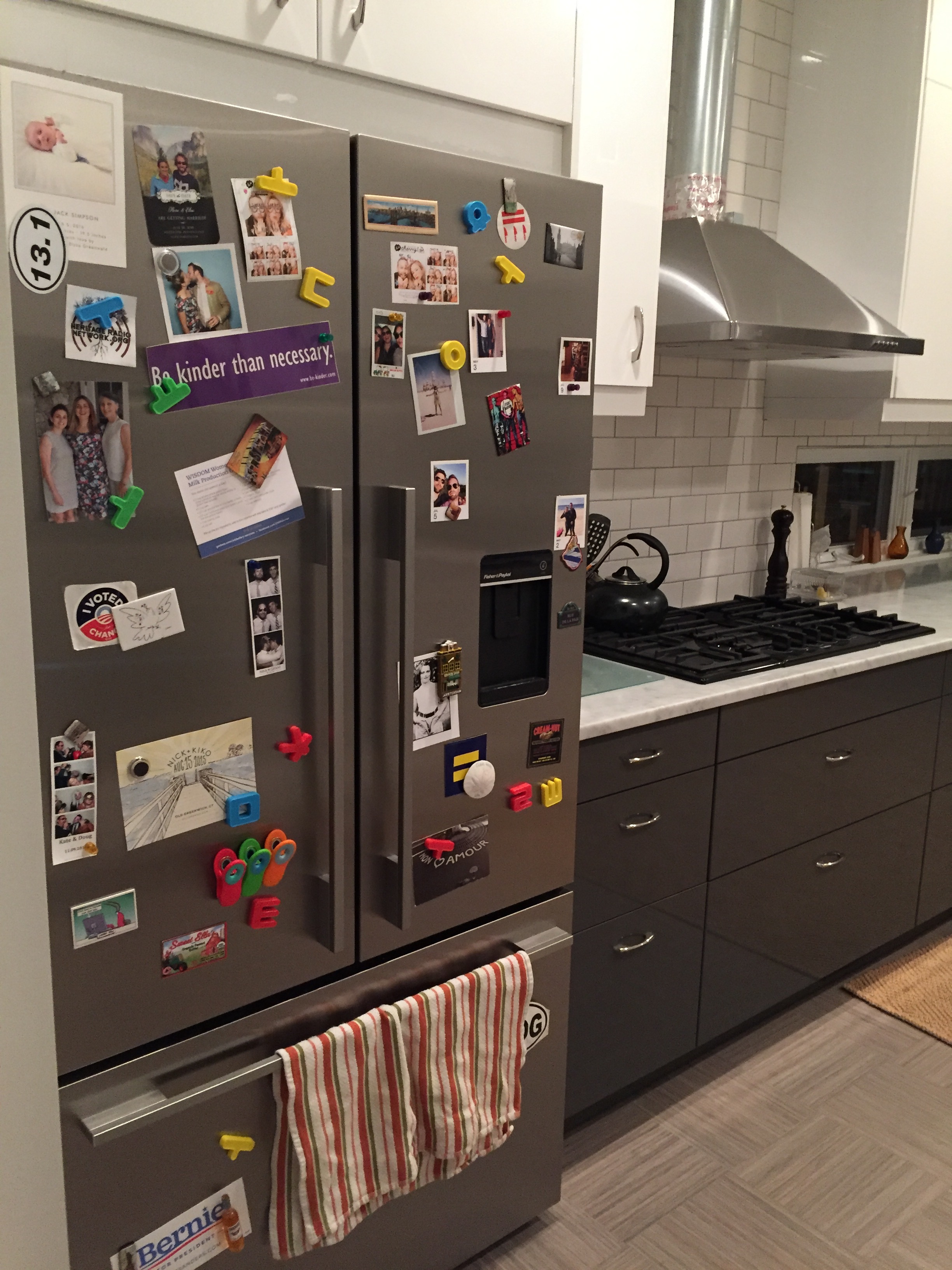 Yes, the kitchen is pretty white--I think that's how we Bourne women like it. So we've been adding the Renzbo "collector's touch", like with our hodgepodge fridge back in action (chose this Fisher & Paykel model because it's magnetic.)