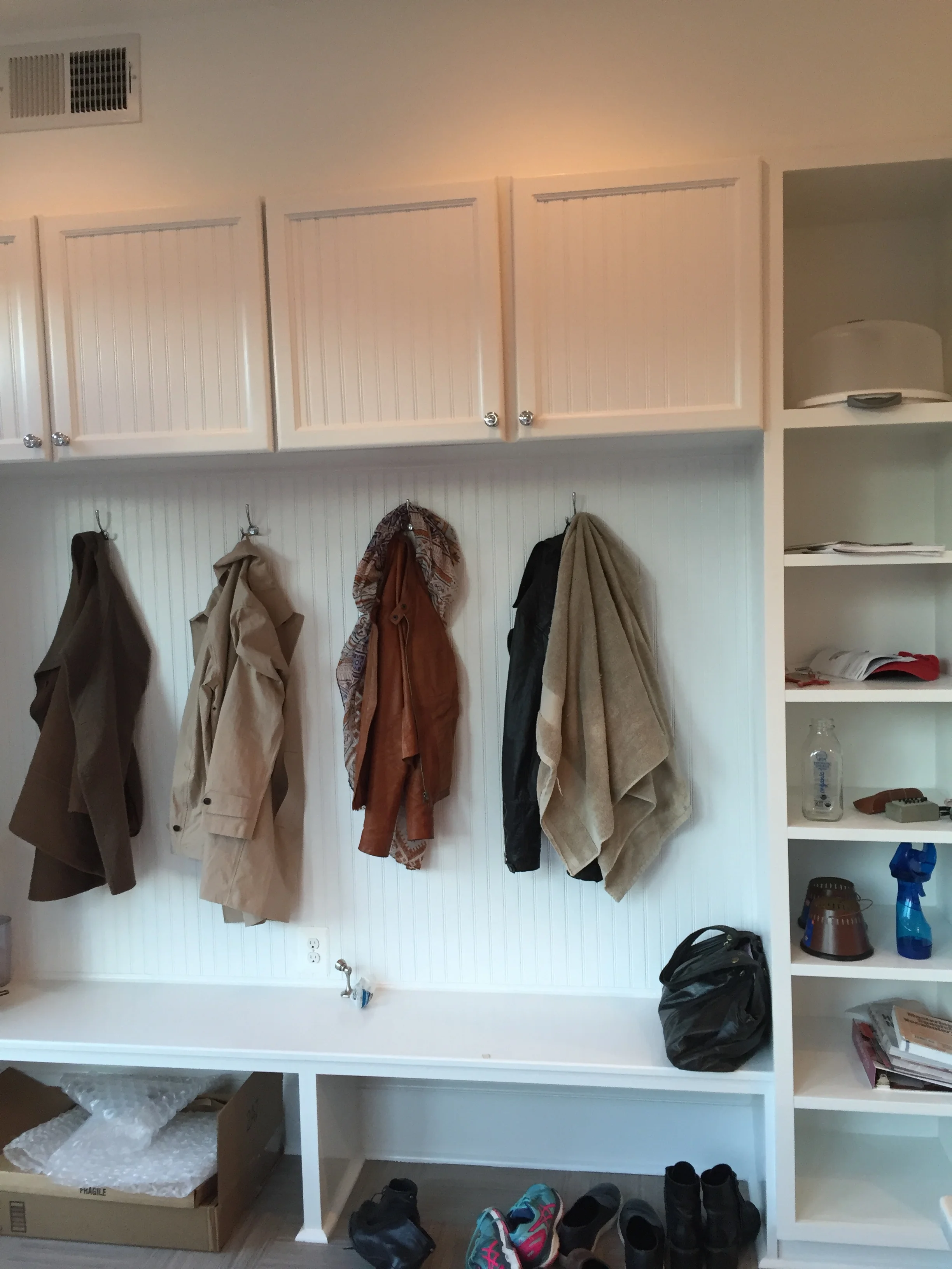 Our project manager Noe, who was a cabinet maker in Guatemala, banged out our mudroom from scratch. Might I add he had a baby mid-way through our project, and was back about two days later? Intense. We're still waiting on the baskets for the right column compartments. 