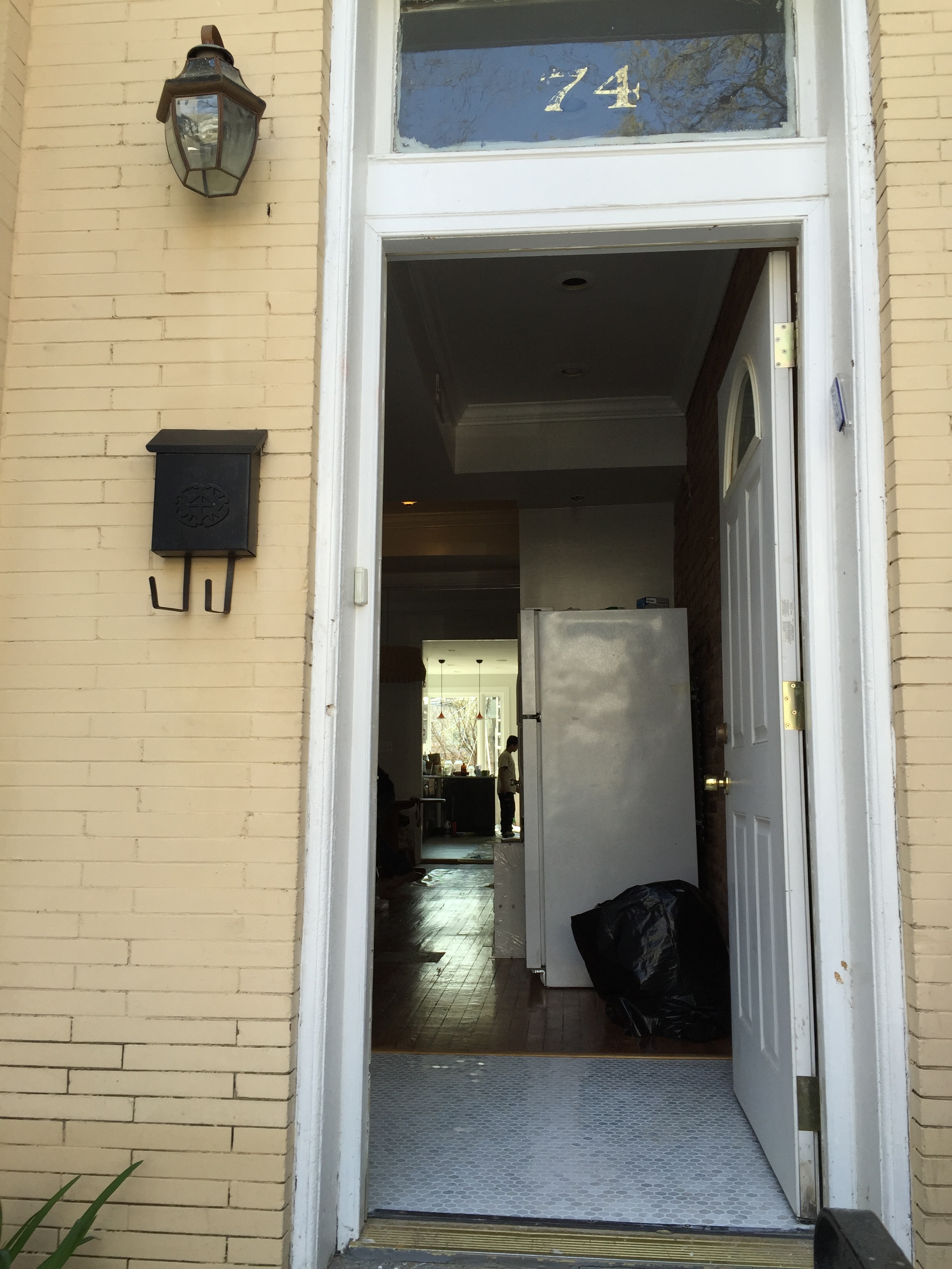 We redid the tiles in the entryway of our front door with marble hexagons. Now when someone opens the front door, they can see all the way to the park.