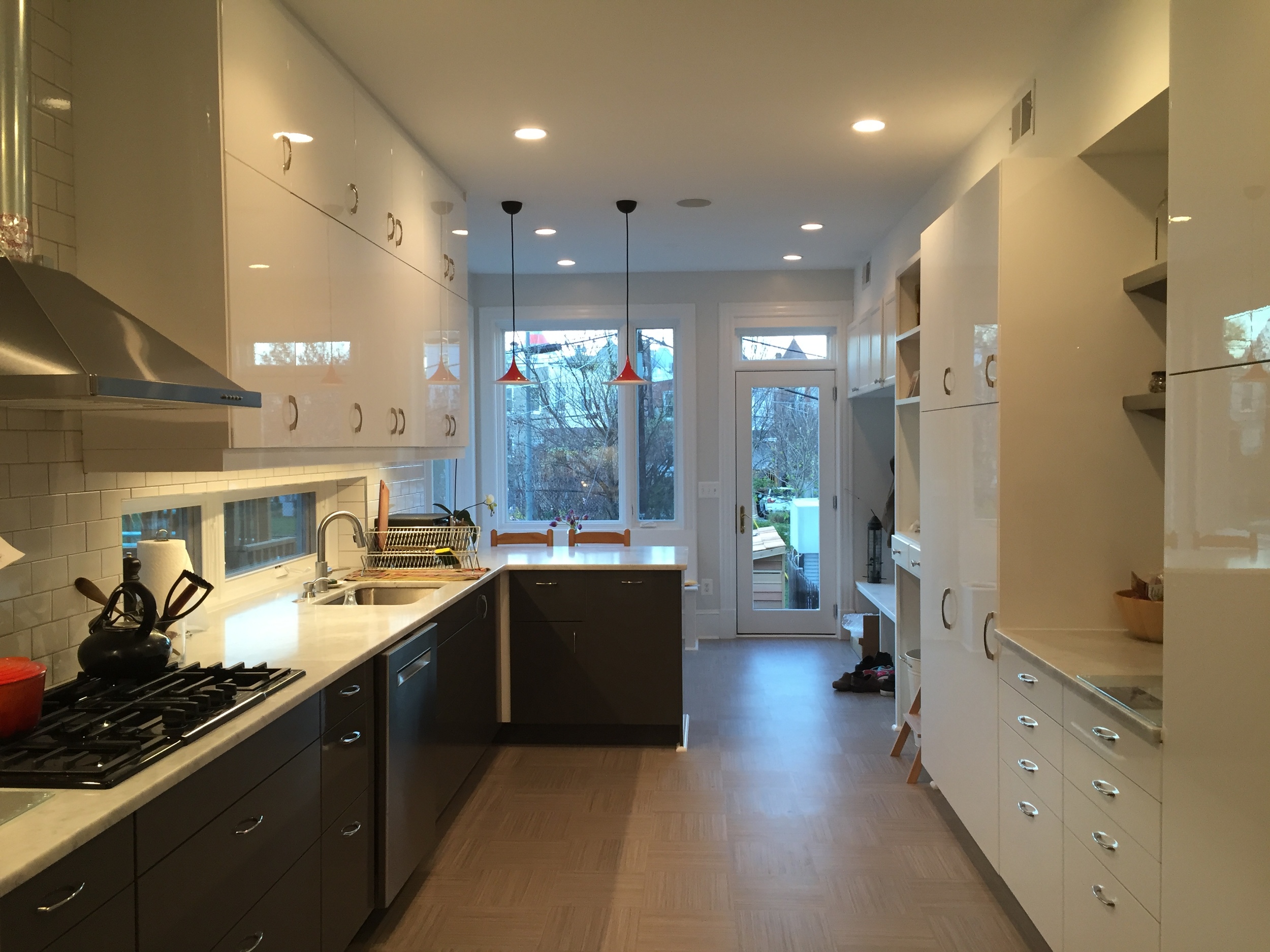 And the view looking into the kitchen from the dining room. We're pretty stoked about our Forbo "click" linoleum floors--very soft with their cork underside, and hide dirt like nobody's business.