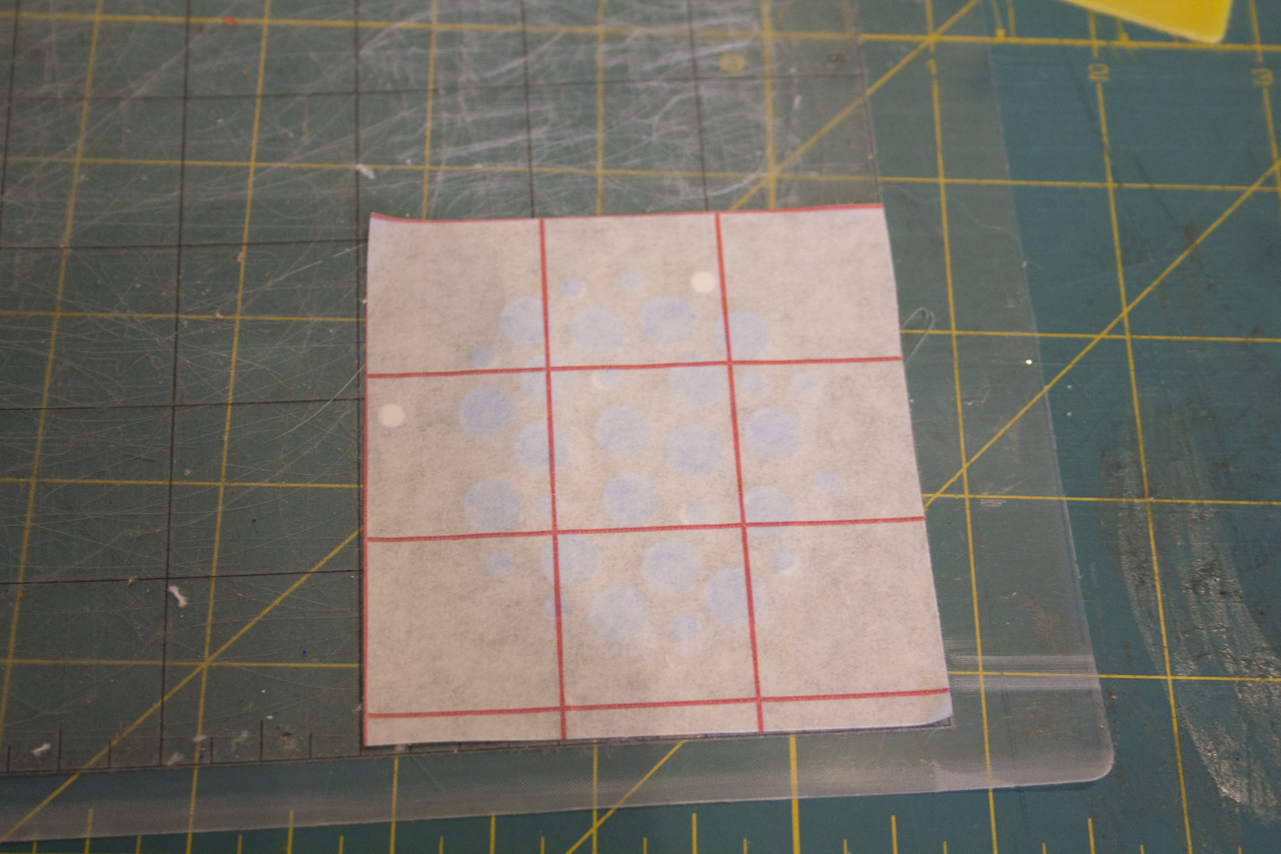 perhaps a bit difficult to see but all the small dots are held into place with the transfer tape, lay that on top to of the larger circle and you have a golfball.