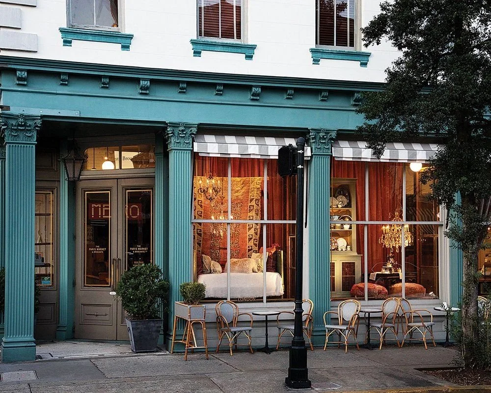 The Paris Market boutique storefront on Broughton Street in Savannah, Georgia with teal exterior and curated window displays