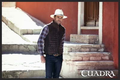 (He was dressed a bit like this, but without the hat. Also, it was a dress shirt instead of a western)