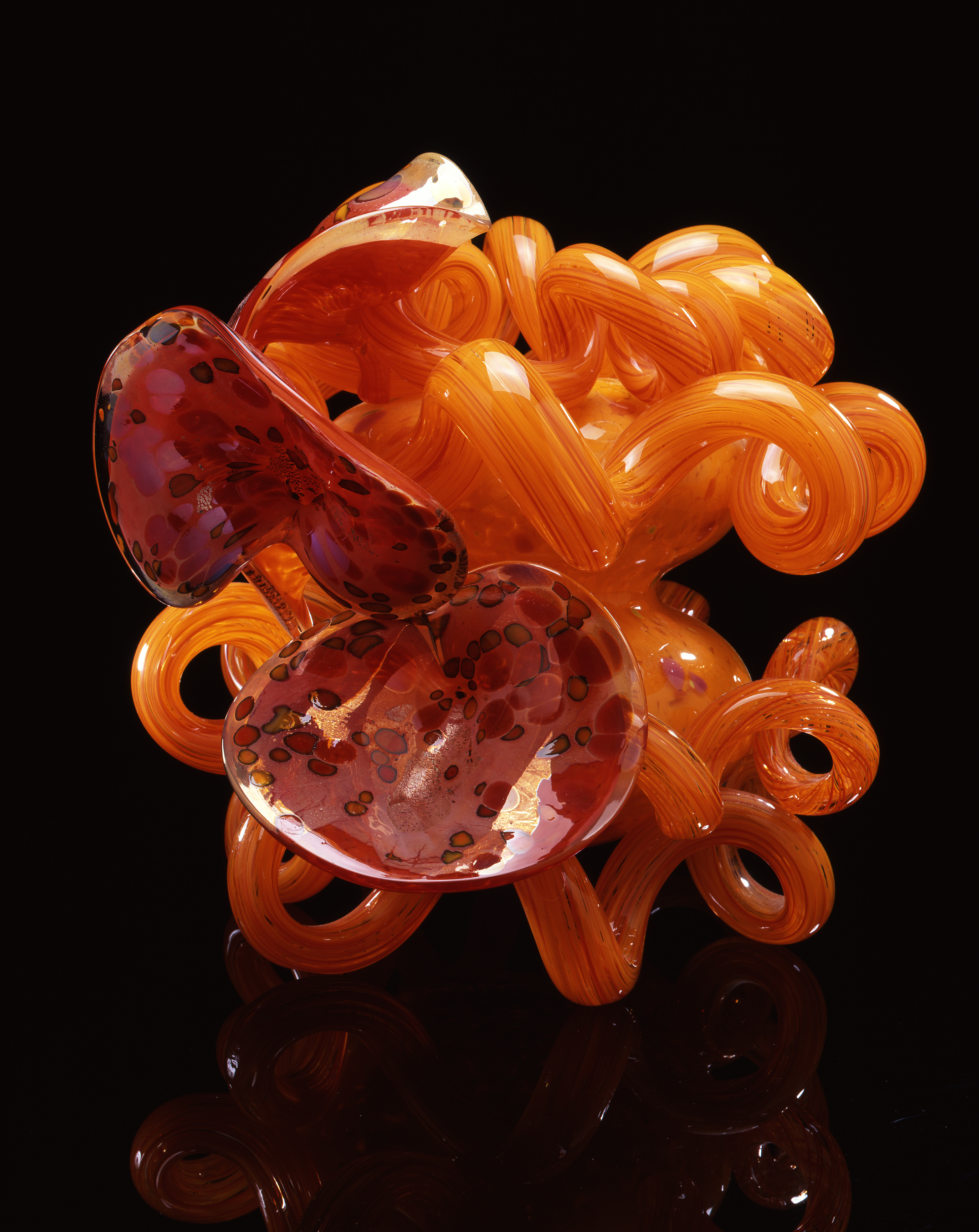  Dale Chihuly,&nbsp; Cadmium Orange Coiled Venetian with Lilies &nbsp;(1991, glass, 17 x 19 x 17 inches) 