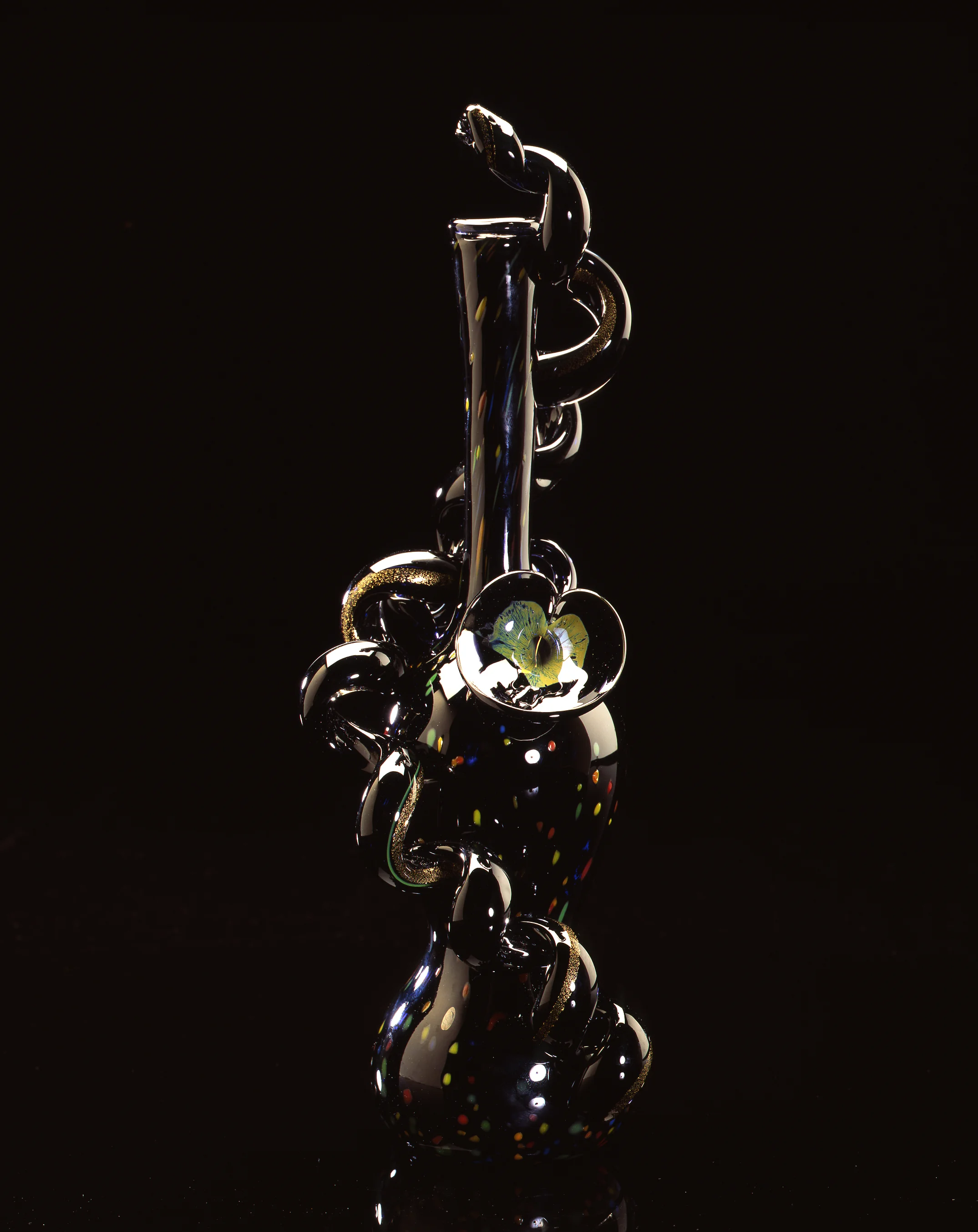 Dale Chihuly, Spotted Black Onyx Piccolo Venetian with Lily and Coil (1994, glass, 15 x 5 x 5 inches)