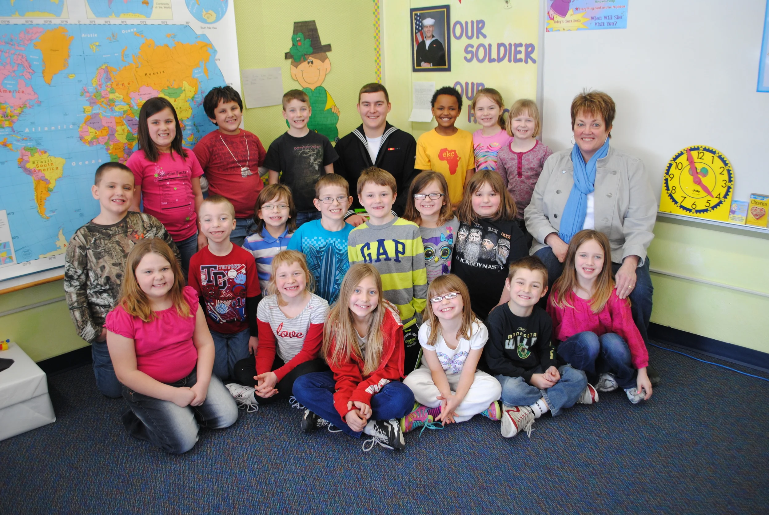 Eliah Anderson is surrounded by Junelle Jackson’s second-grade class, who couldn’t believe their eyes when he arrived today as a surprise guest. They children were all smiles during his visit.