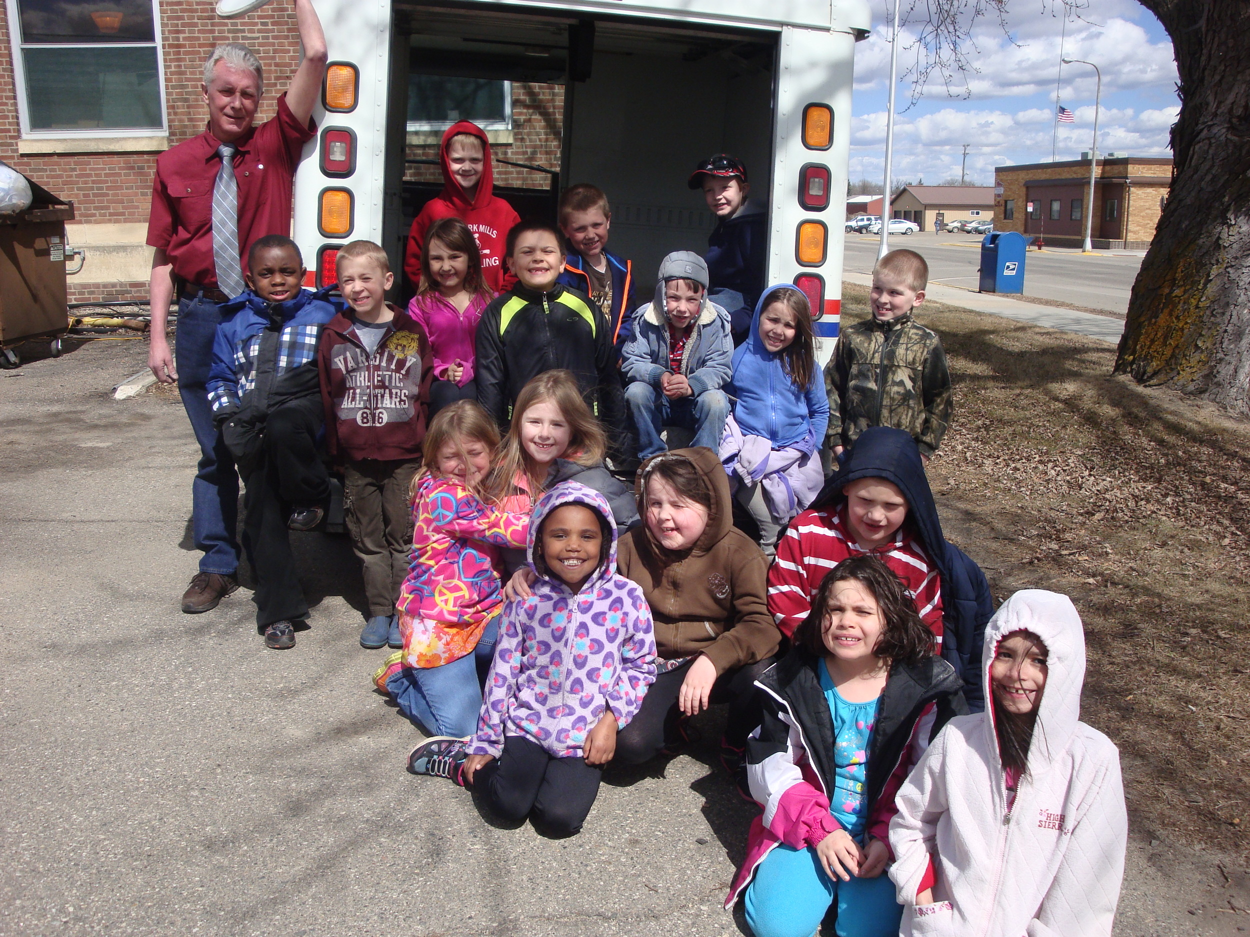 Cheryl Kellen's first-grade students and Wadena Postmaster Jeff Zimmerman. (Photo by Cheryl Kellen, WDC Schools)